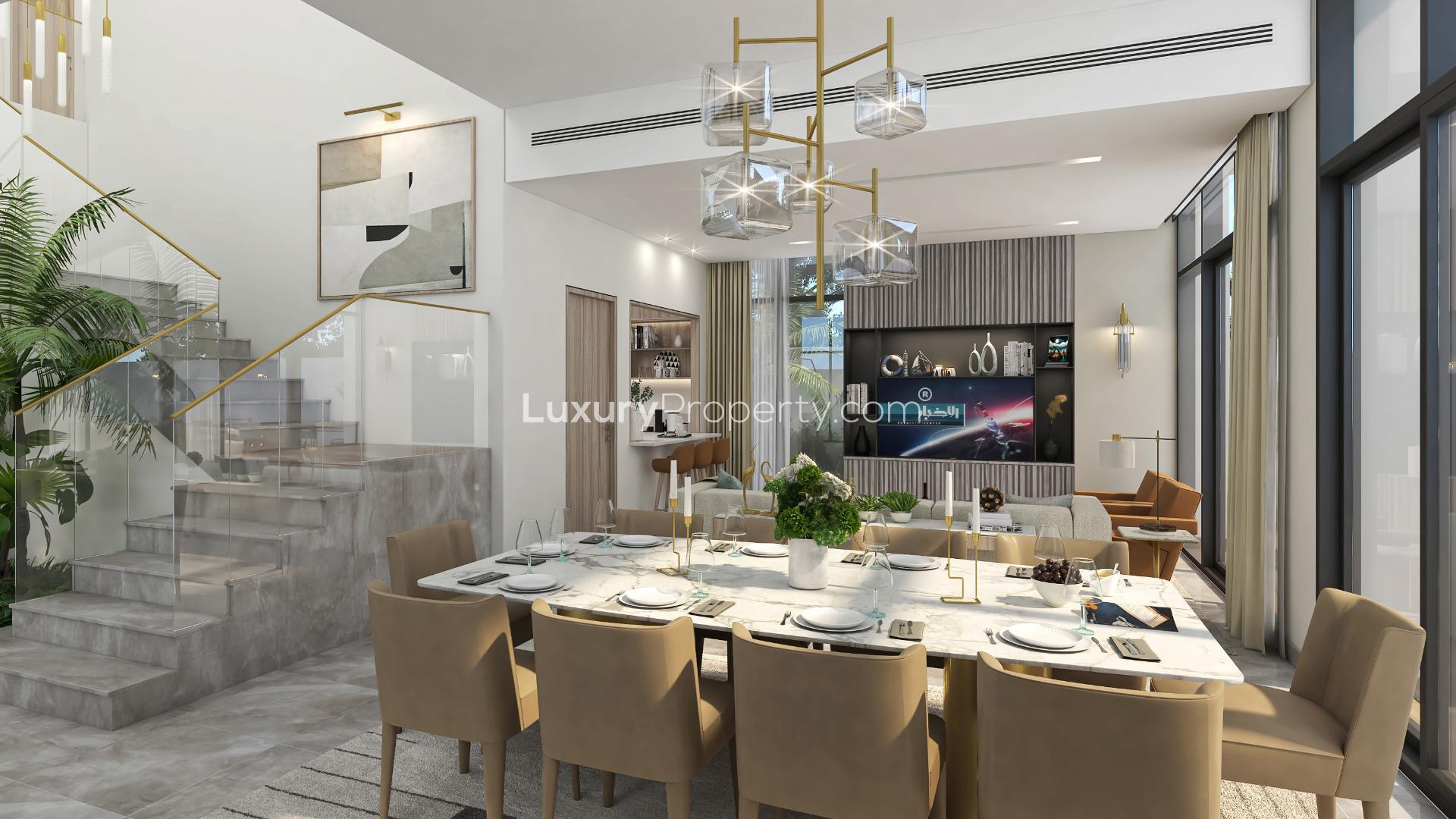 Modern two-story villa with balcony, large windows, and garden in Murooj Al Furjan