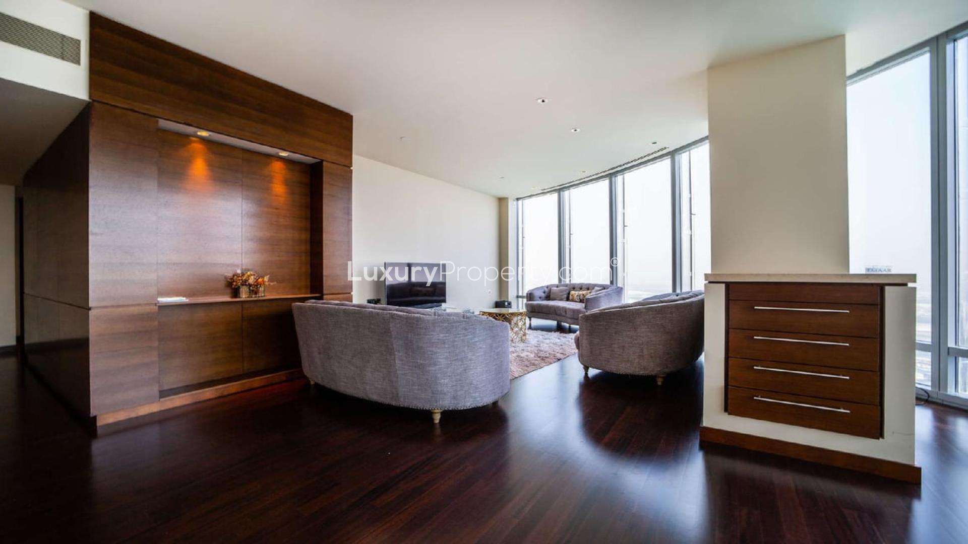 Luxurious living room in 2-bedroom Burj Khalifa apartment, Downtown Dubai, with modern furnishings