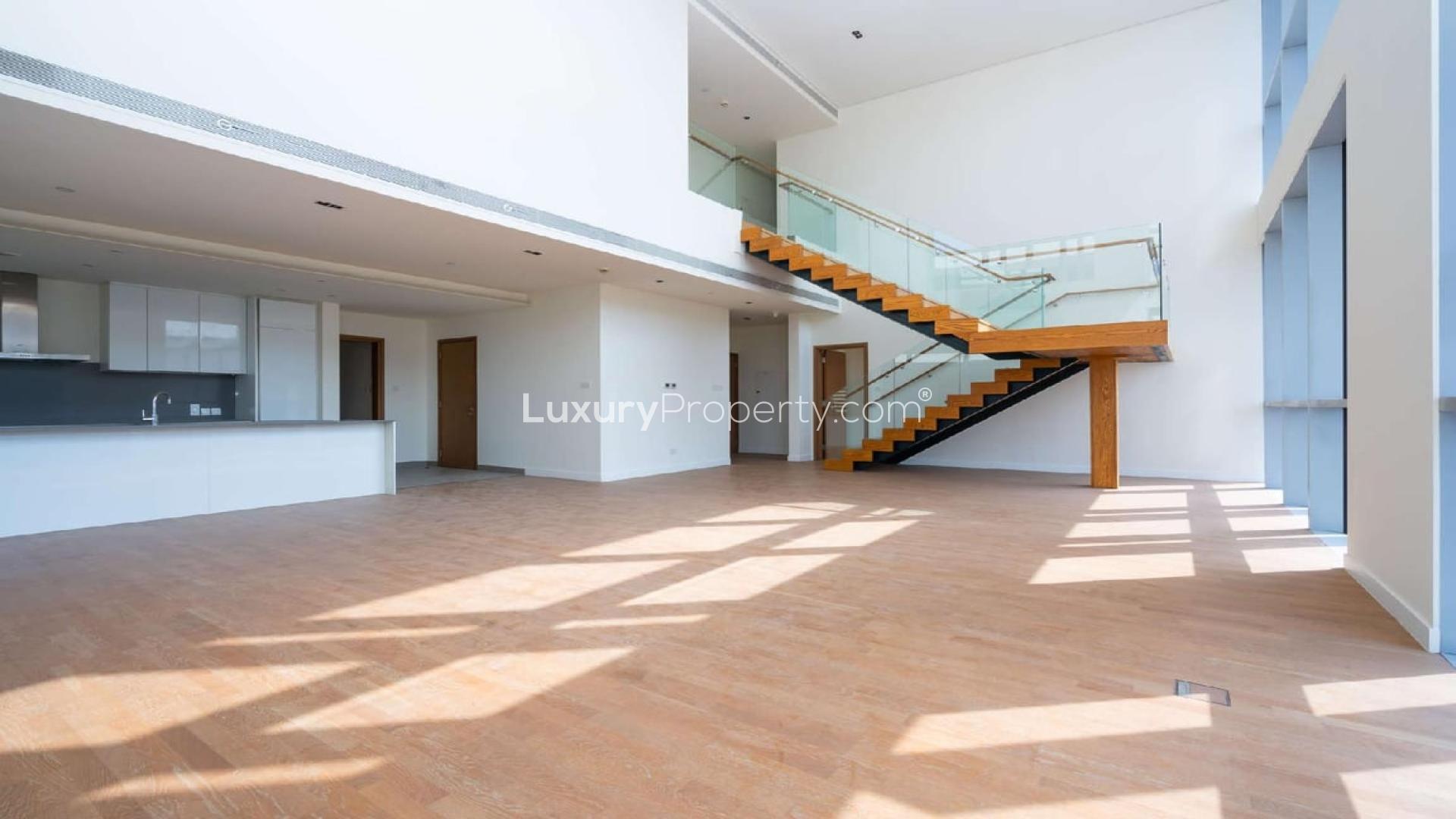 Modern duplex apartment with large windows and staircase in City Walk, Jumeirah