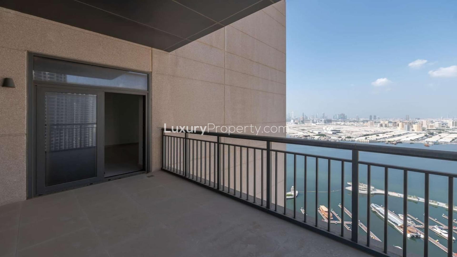 Spacious living room with large window in Dubai Creek Harbour apartment for rent