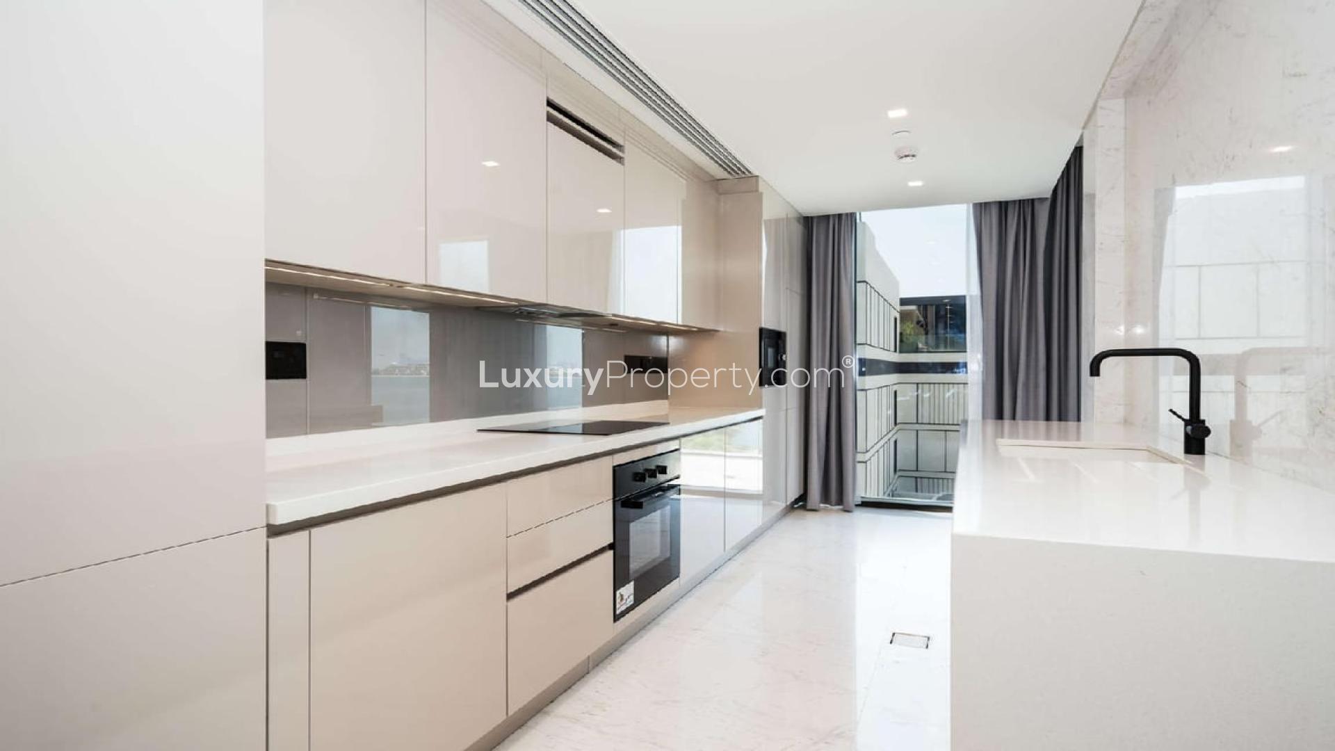 Luxurious living room in Caesars Bluewaters apartment with sea views and modern furnishings