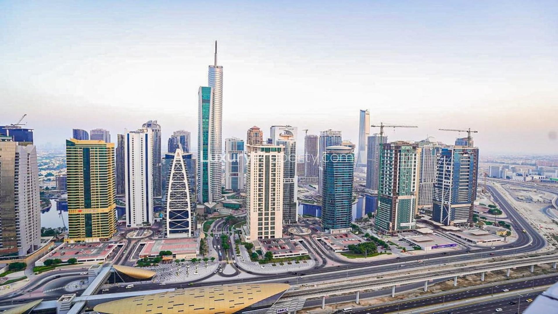 Modern living room in Horizon Tower, Dubai Marina apartment with large windows and stylish decor