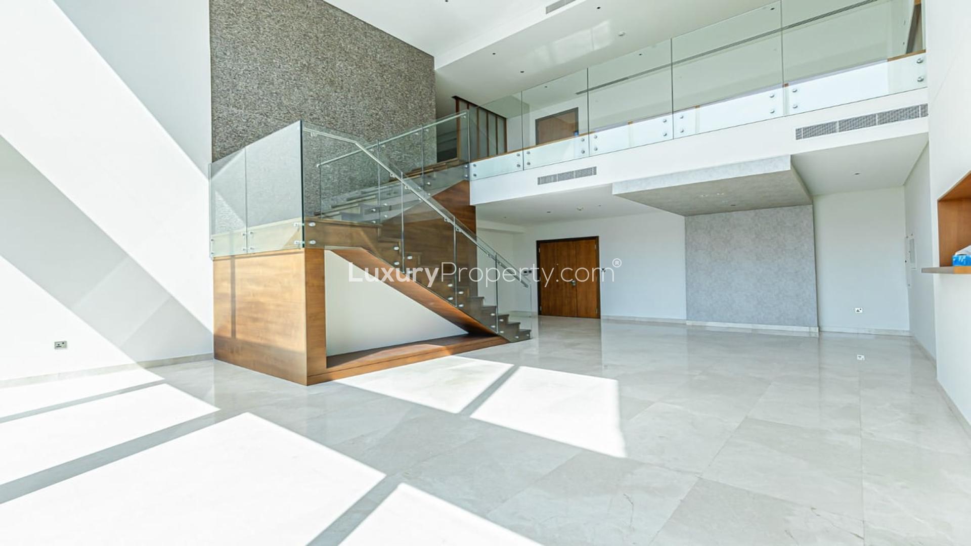 "Stunning view from luxury duplex balcony in Marina Gate 1, Dubai Marina apartment for rent.",Luxury duplex interior with glass staircase in Marina Gate 1, Dubai Marina apartment