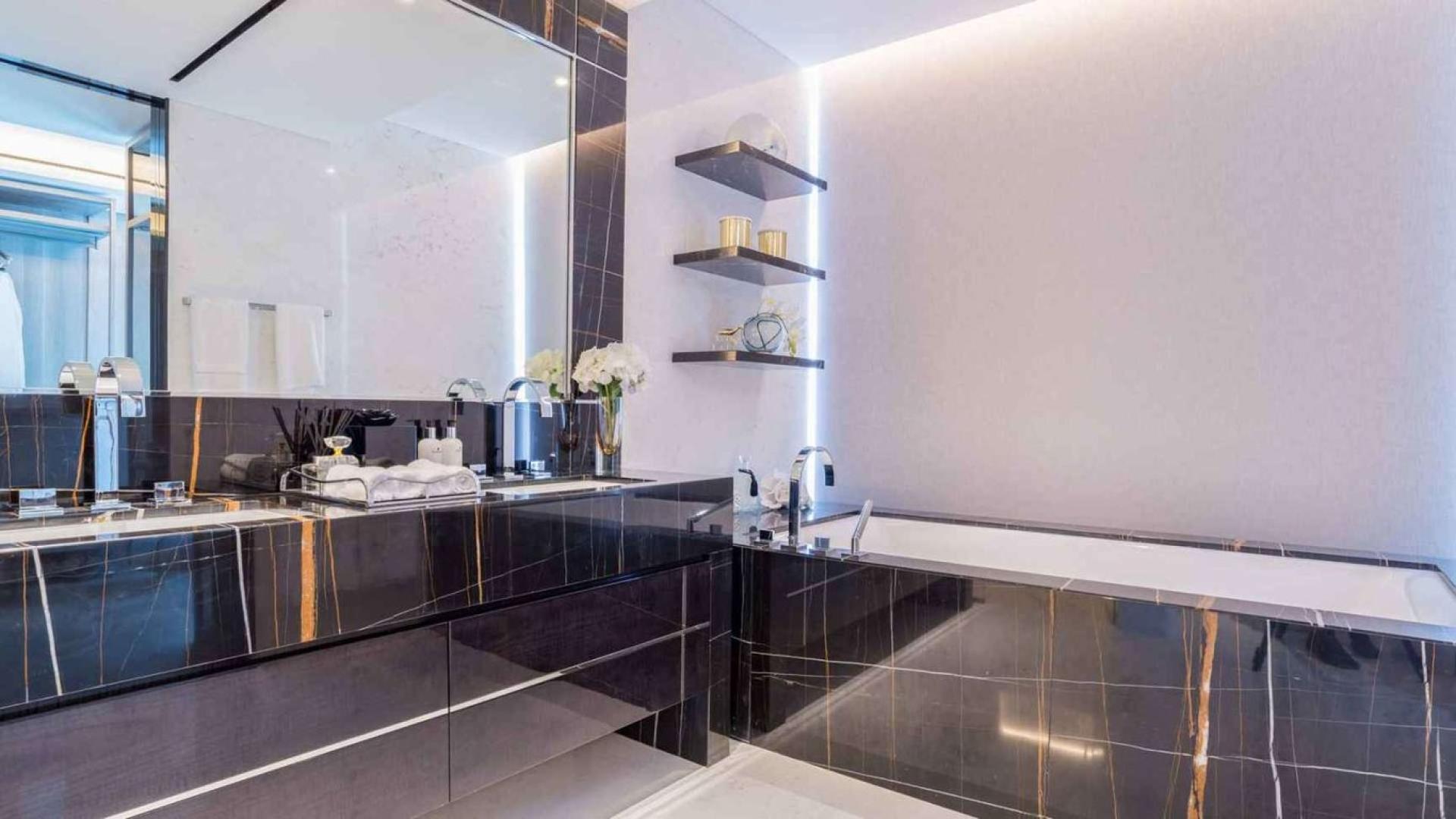 Luxurious bathroom in beachfront duplex apartment, One Palm Jumeirah, marble finishes, elegant design