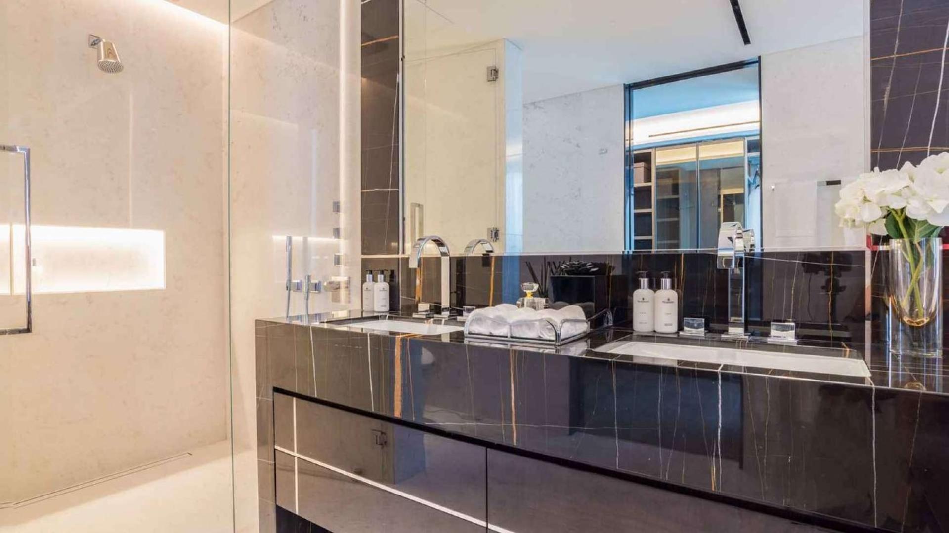 Luxurious living room in beachfront duplex apartment, One Palm Jumeirah, elegant decor and lighting