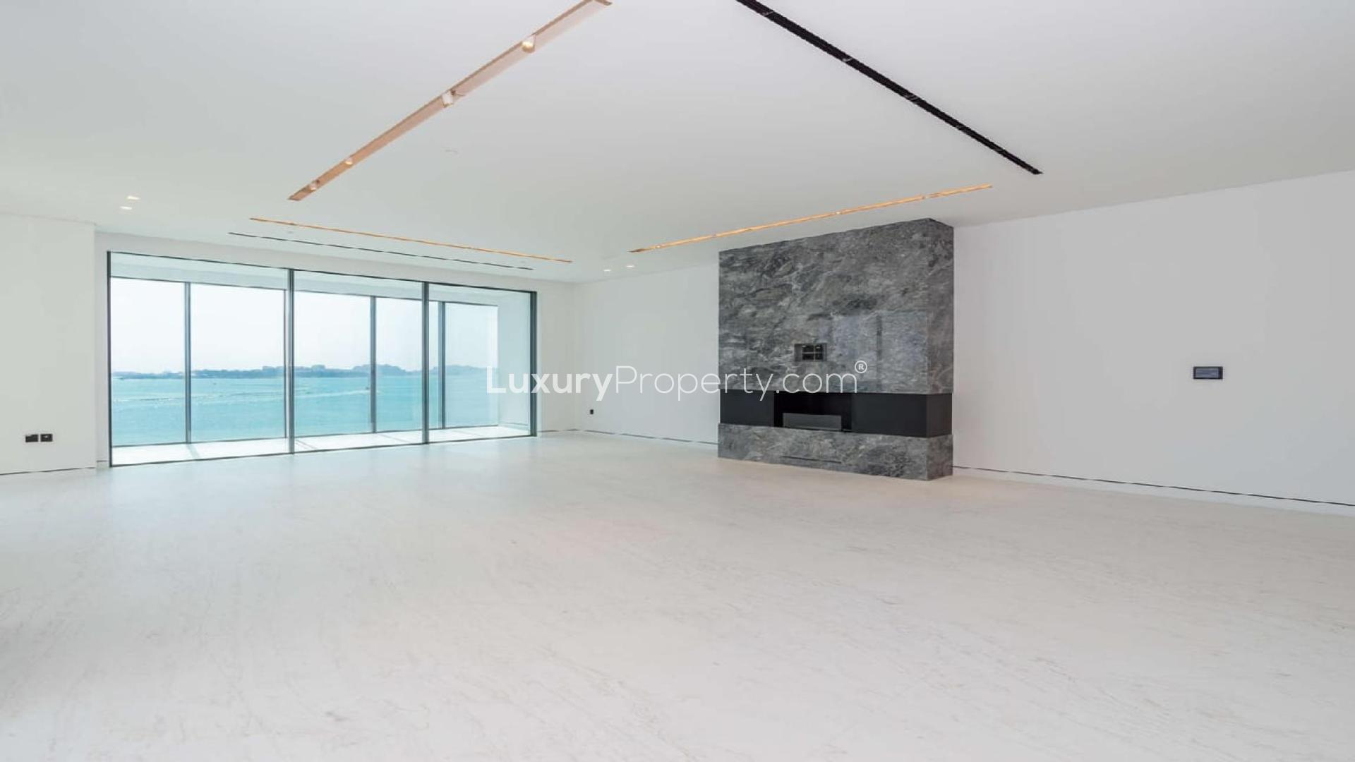 Modern kitchen with sleek cabinets and marble backsplash in Palme Couture apartment, Palm Jumeirah
