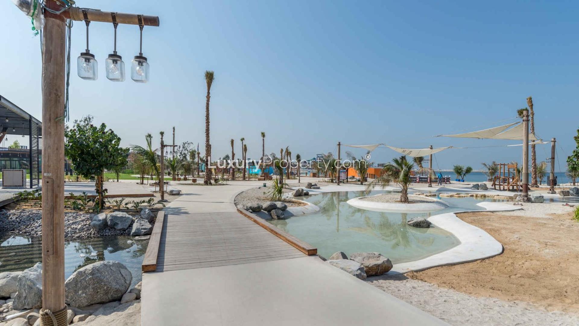 Four-bedroom apartment balcony view of Dubai skyline and waterfront at La Cote, Jumeirah