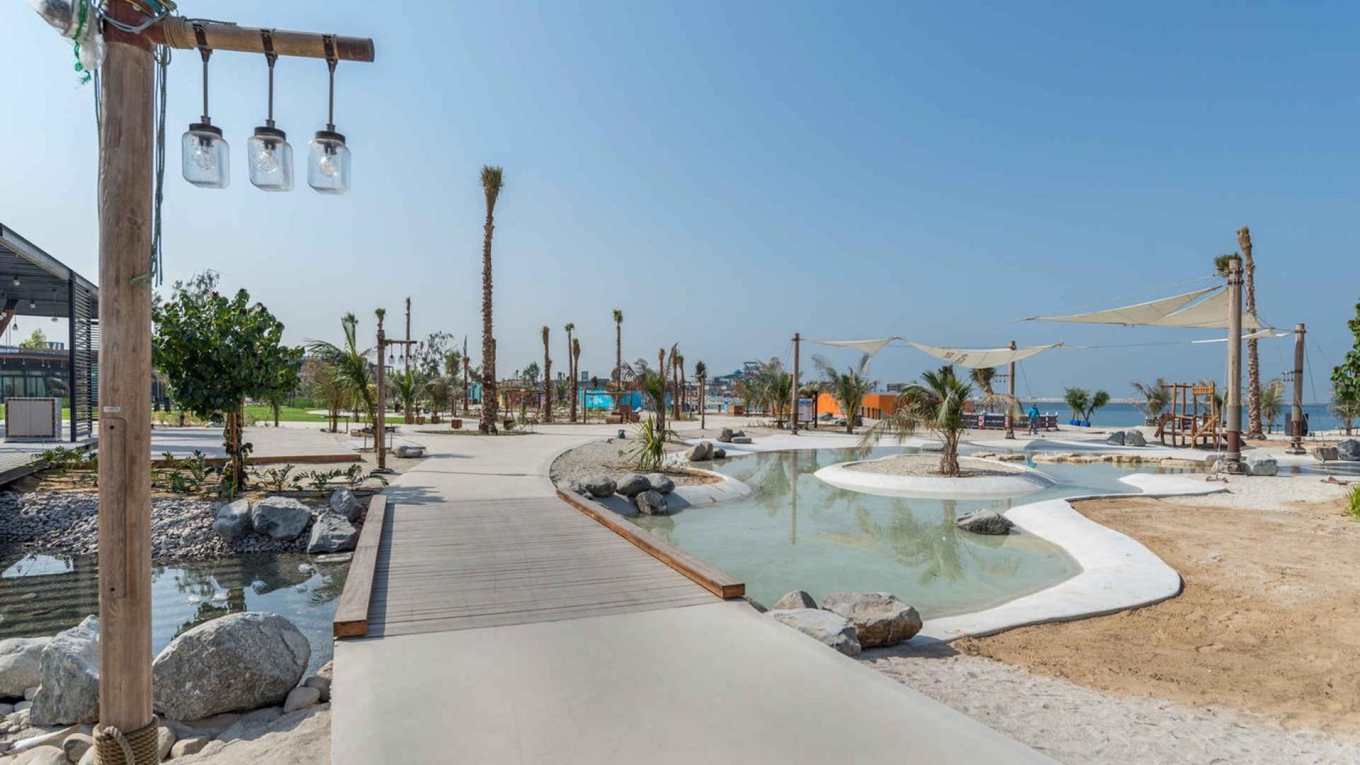 Four-bedroom apartment balcony view of Dubai skyline and waterfront at La Cote, Jumeirah