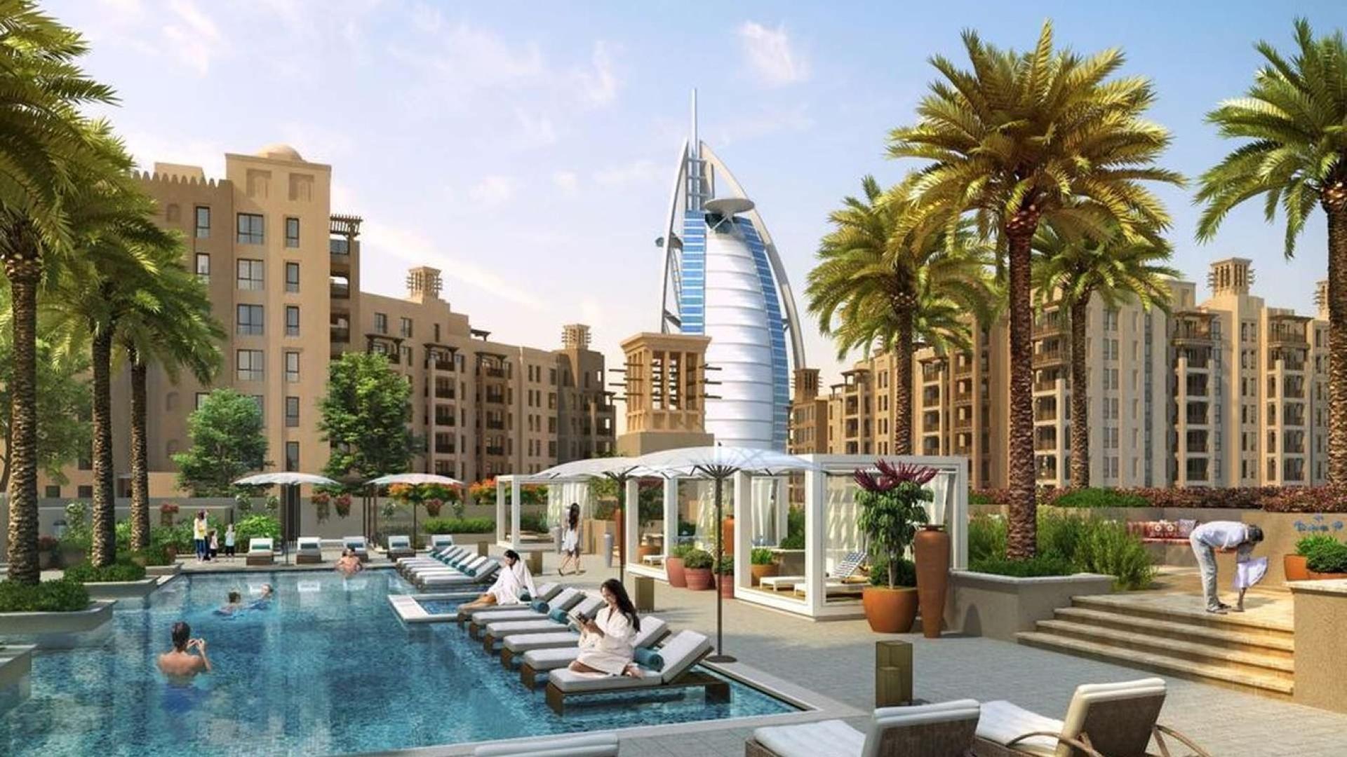 N/A,Luxurious poolside view at Rahaal, Madinat Jumeirah Living, with iconic architecture and palm trees