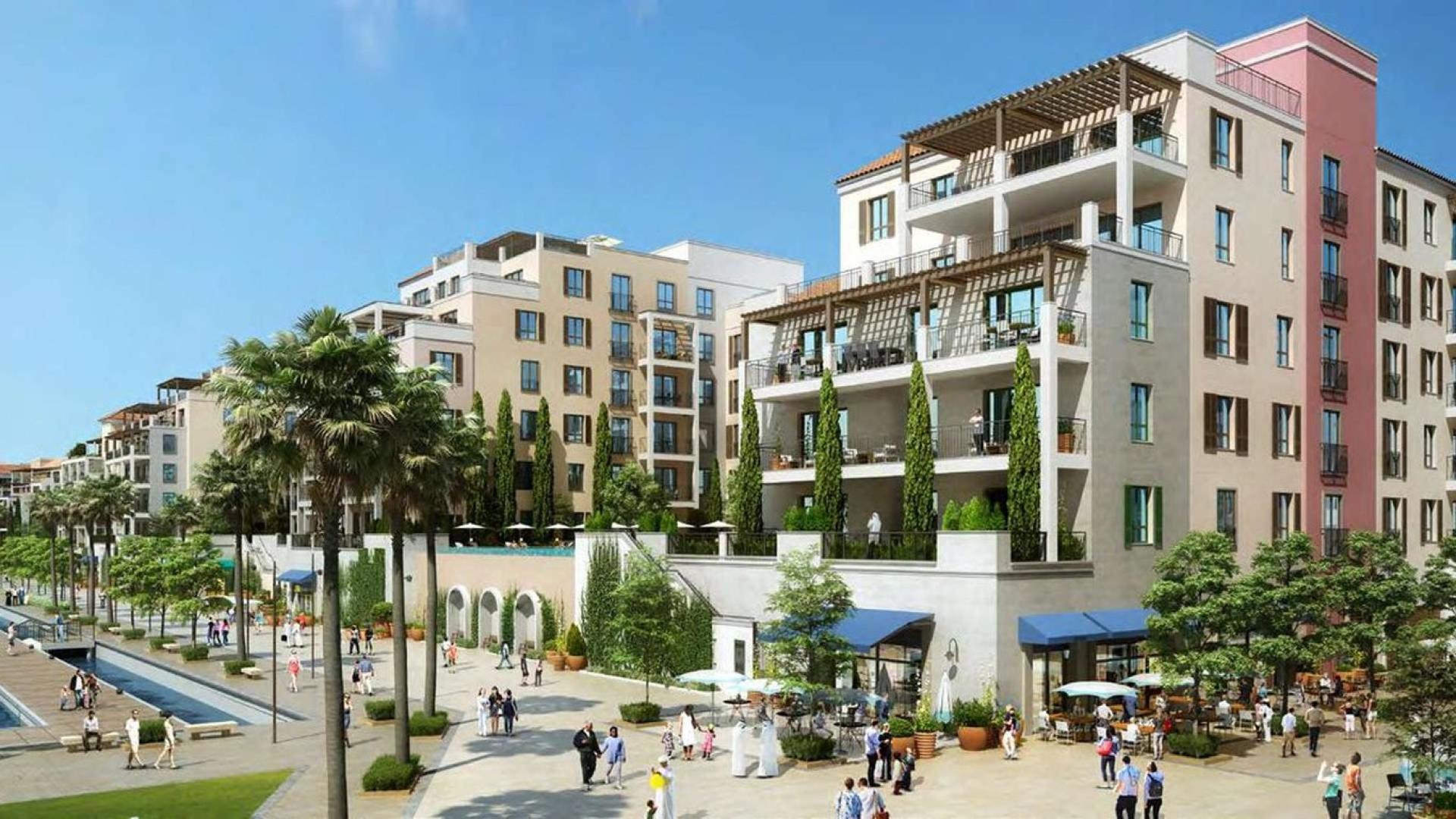 Courtyard view of La Rive apartment complex with balconies and landscaped garden, Jumeirah