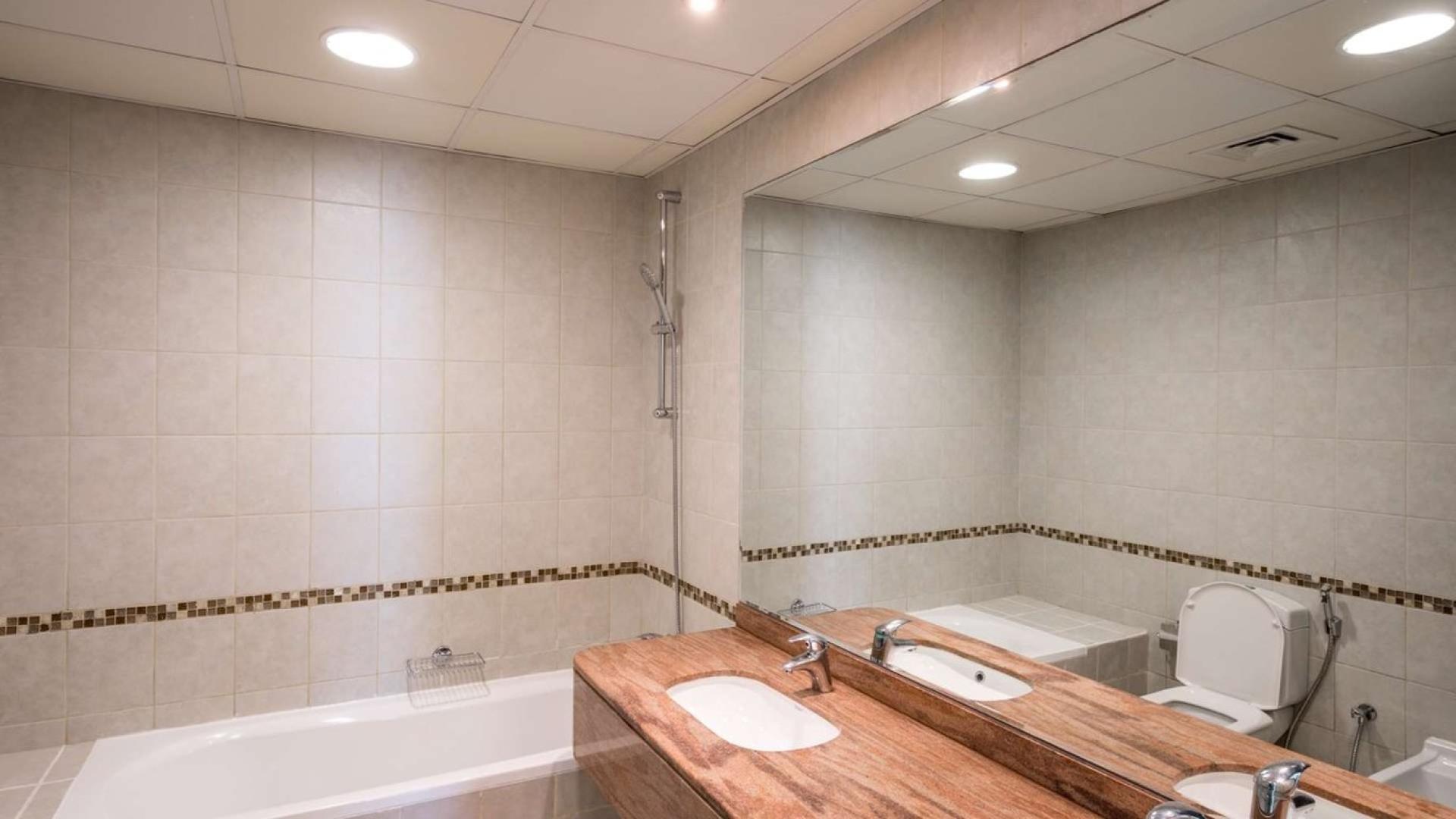 Luxurious bathroom in four-bedroom apartment, Oceanic, Dubai Marina, featuring modern fixtures and elegant design