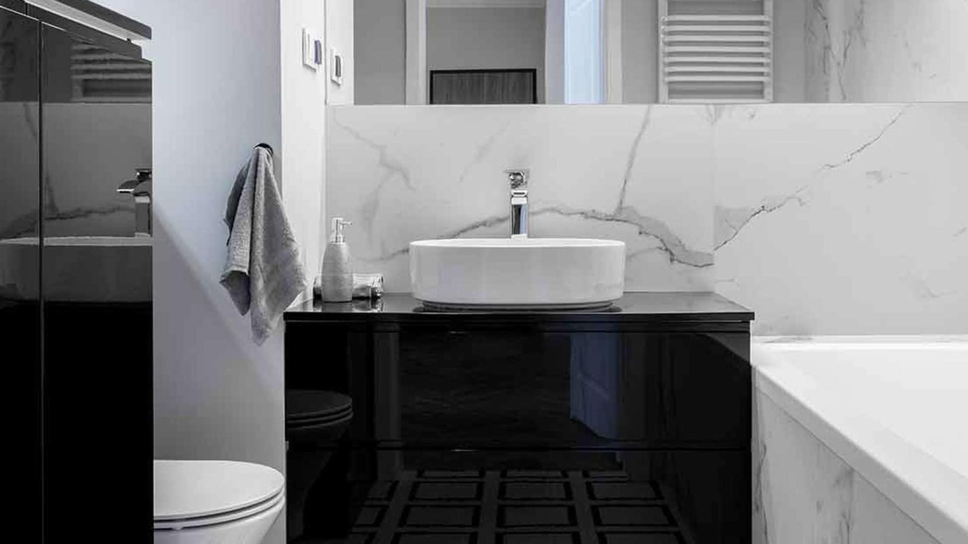 "Luxury Sobha Hartland apartment with city skyline view, Mohammed Bin Rashid City, for sale.",Modern bathroom in One Park Avenue apartment, Sobha Hartland, with sleek black and white design