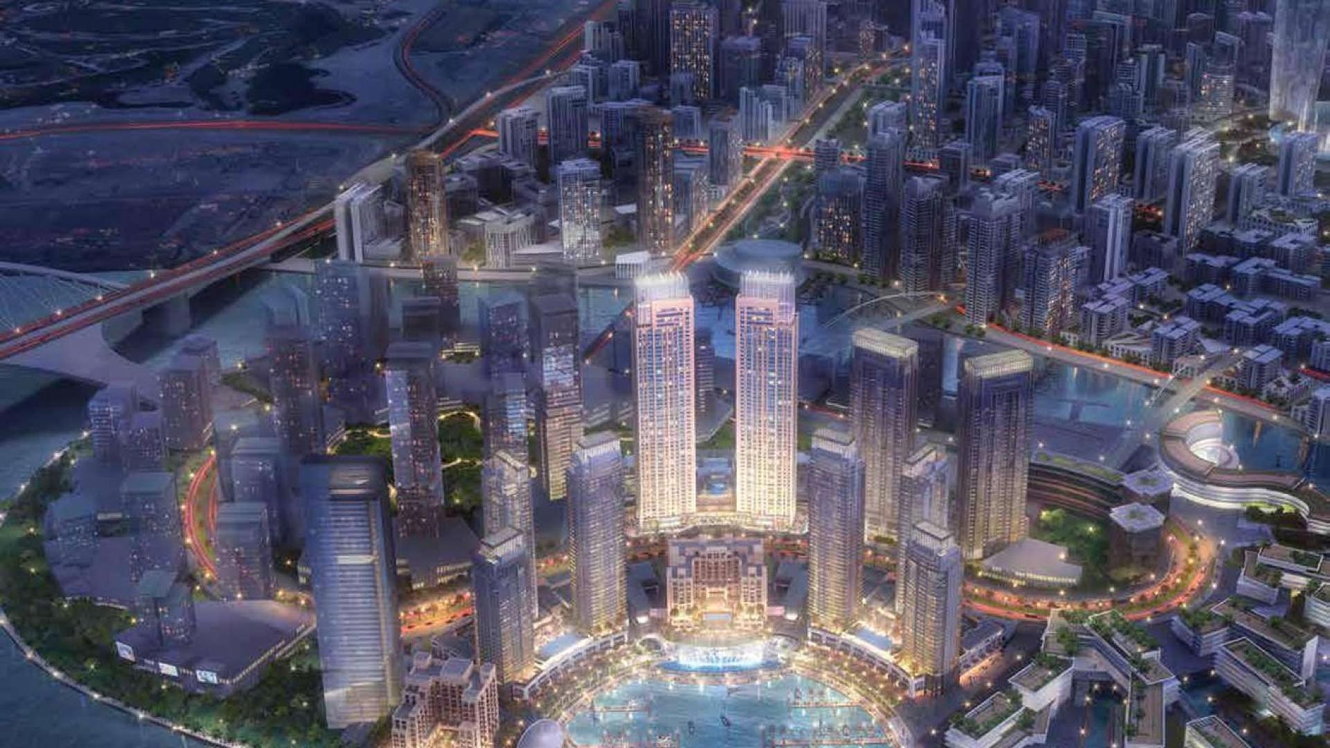 Spacious living room with balcony, stunning city skyline view in Dubai Creek Harbour apartment