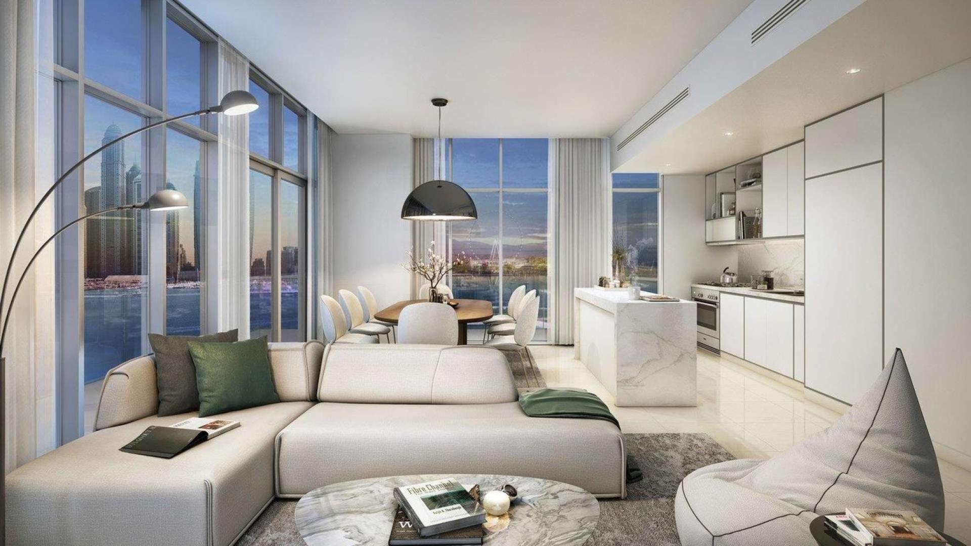 "Luxury Emaar Beachfront apartment view with yachts, Dubai Harbour skyline, turquoise waters.",Modern living room in Sunrise Bay apartment, Emaar Beachfront, Dubai Harbour, with stunning views