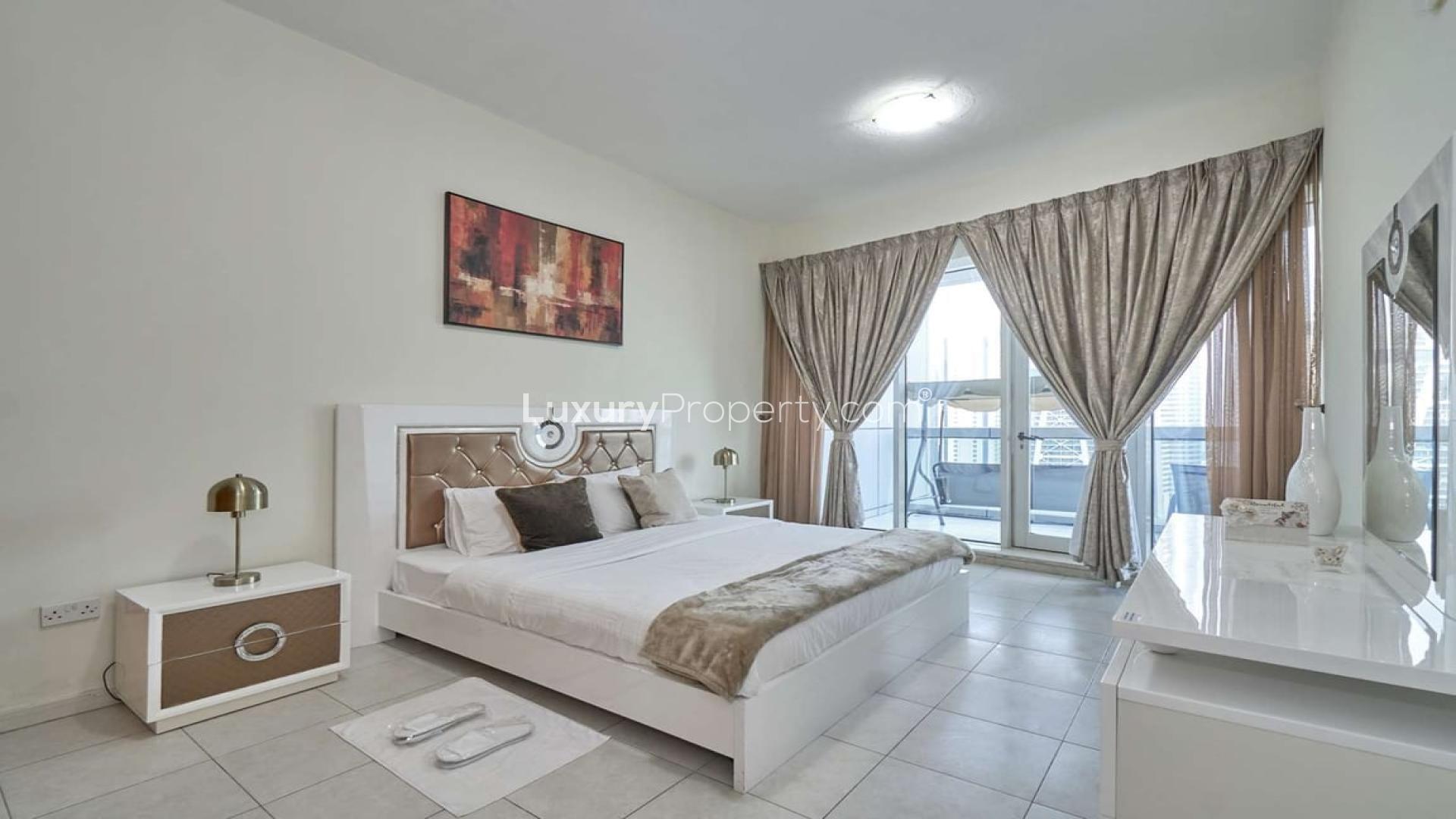 Fully-furnished bedroom in four-bed apartment, Horizon Tower, Dubai Marina with balcony view