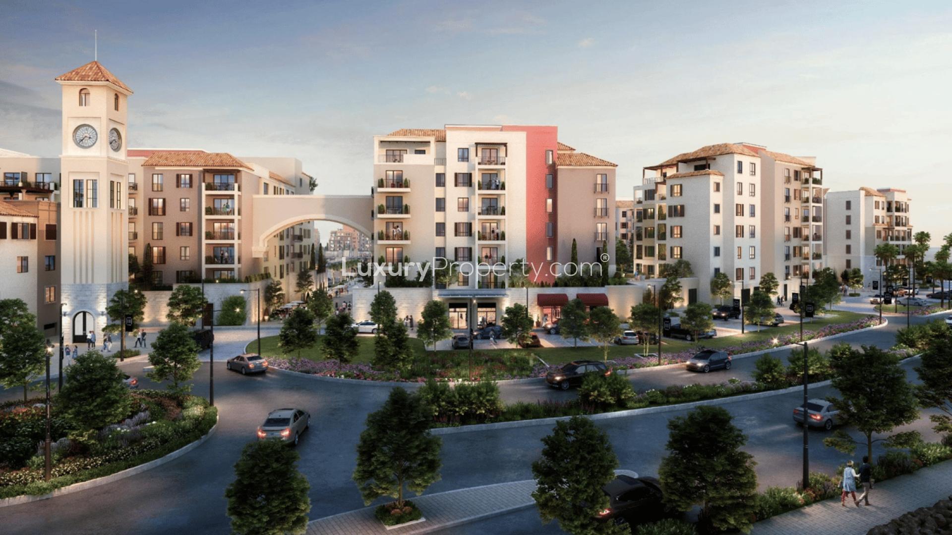 La Mer waterfront apartment view with yachts, palm trees, and modern residential buildings
