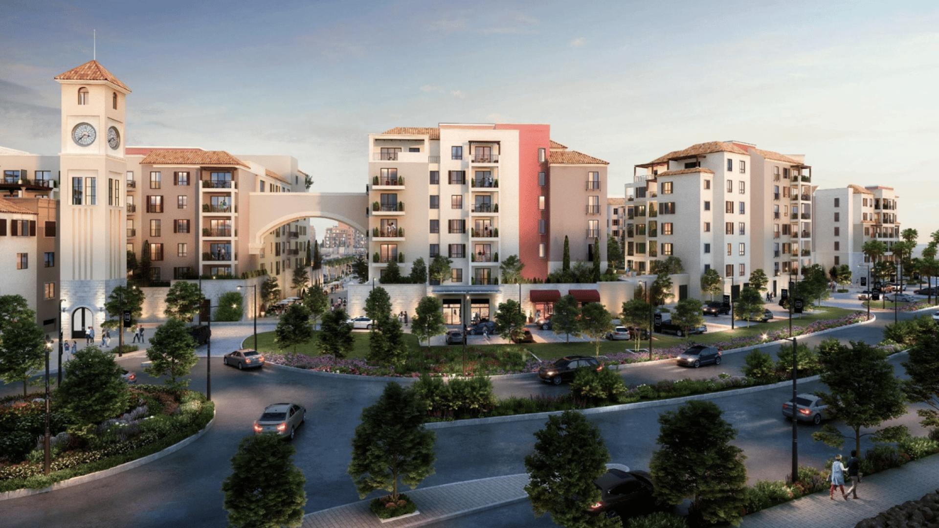 La Mer waterfront apartment view with yachts, palm trees, and modern residential buildings