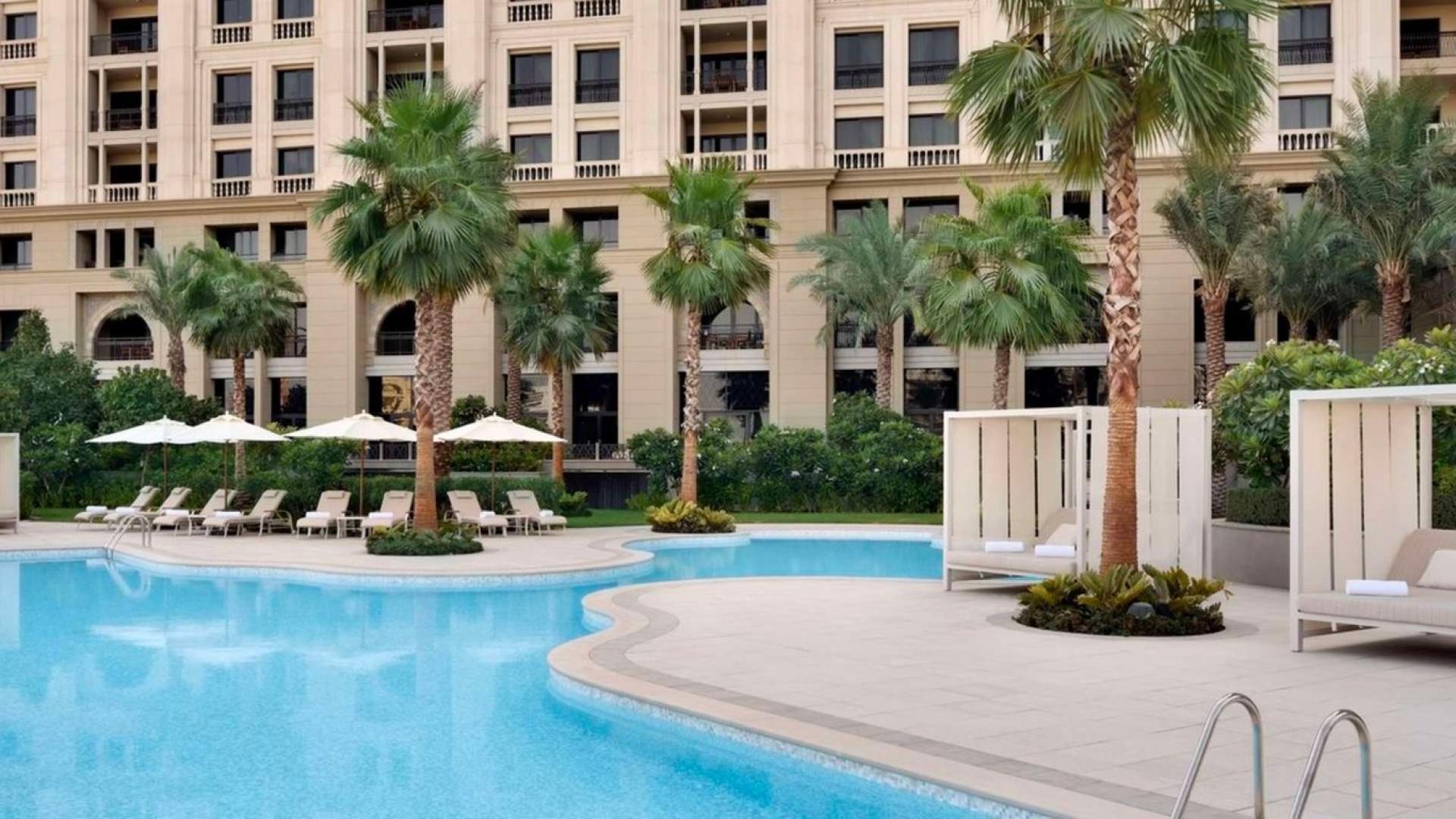 Luxury poolside view at Palazzo Versace, Culture Village, four-bedroom serviced apartment for sale