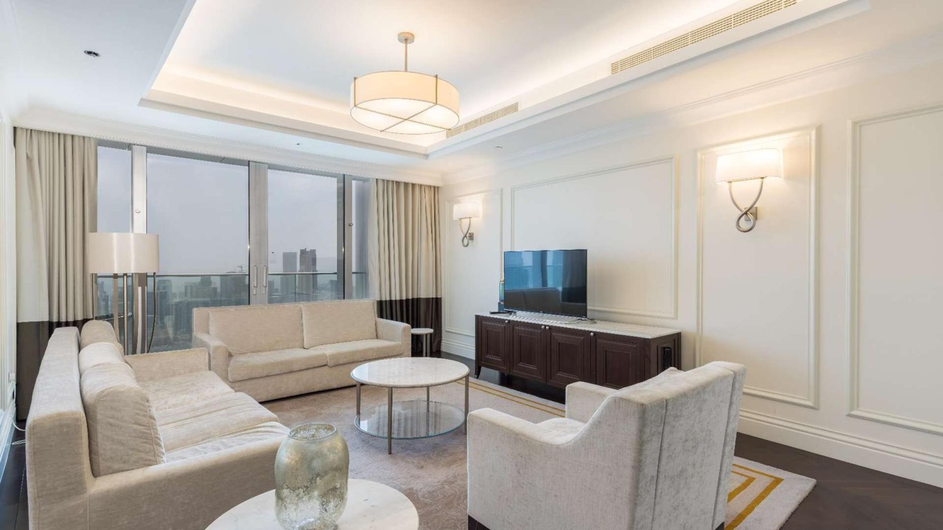Luxurious living room in Downtown Dubai apartment with Burj Khalifa view, spacious layout