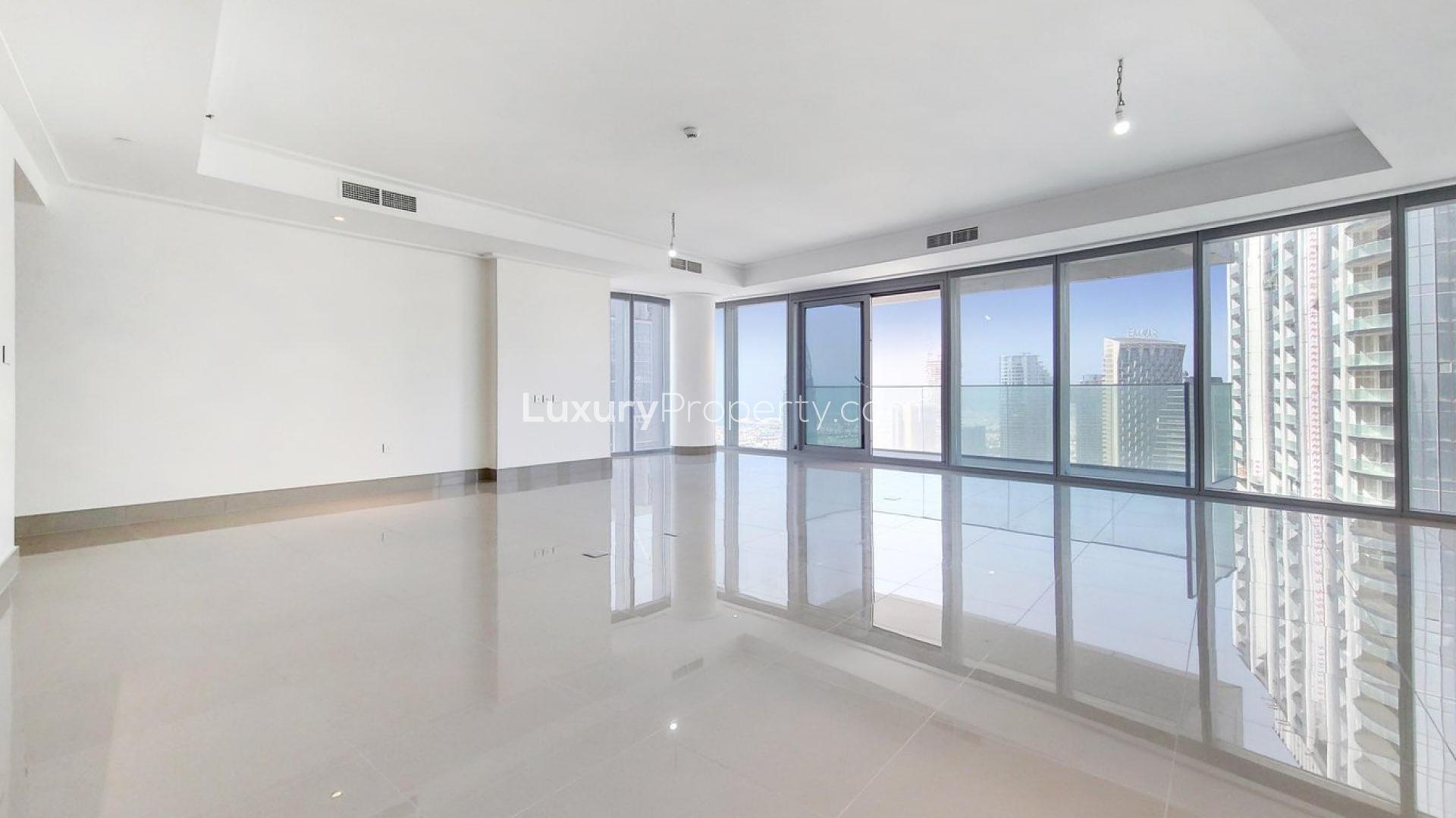 "Bright living room with city skyline view in Opera Grand, Downtown Dubai apartment.",Spacious living area in luxury 4-bedroom apartment, Opera Grand, Downtown Dubai, Burj Khalifa views
