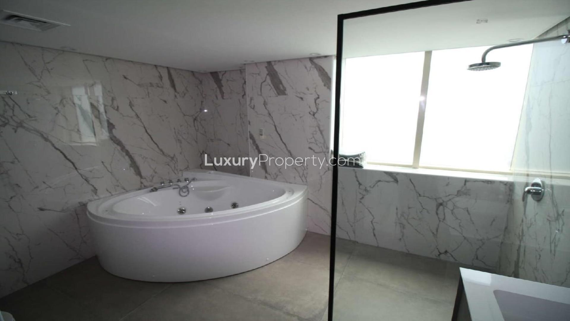 Dining area in luxury 4-bedroom penthouse, Dubai Marina, with elegant table and chairs