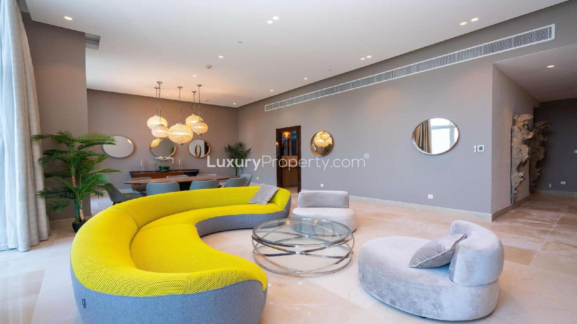 Luxurious Oceana penthouse living room with panoramic views, modern decor, and elegant furnishings