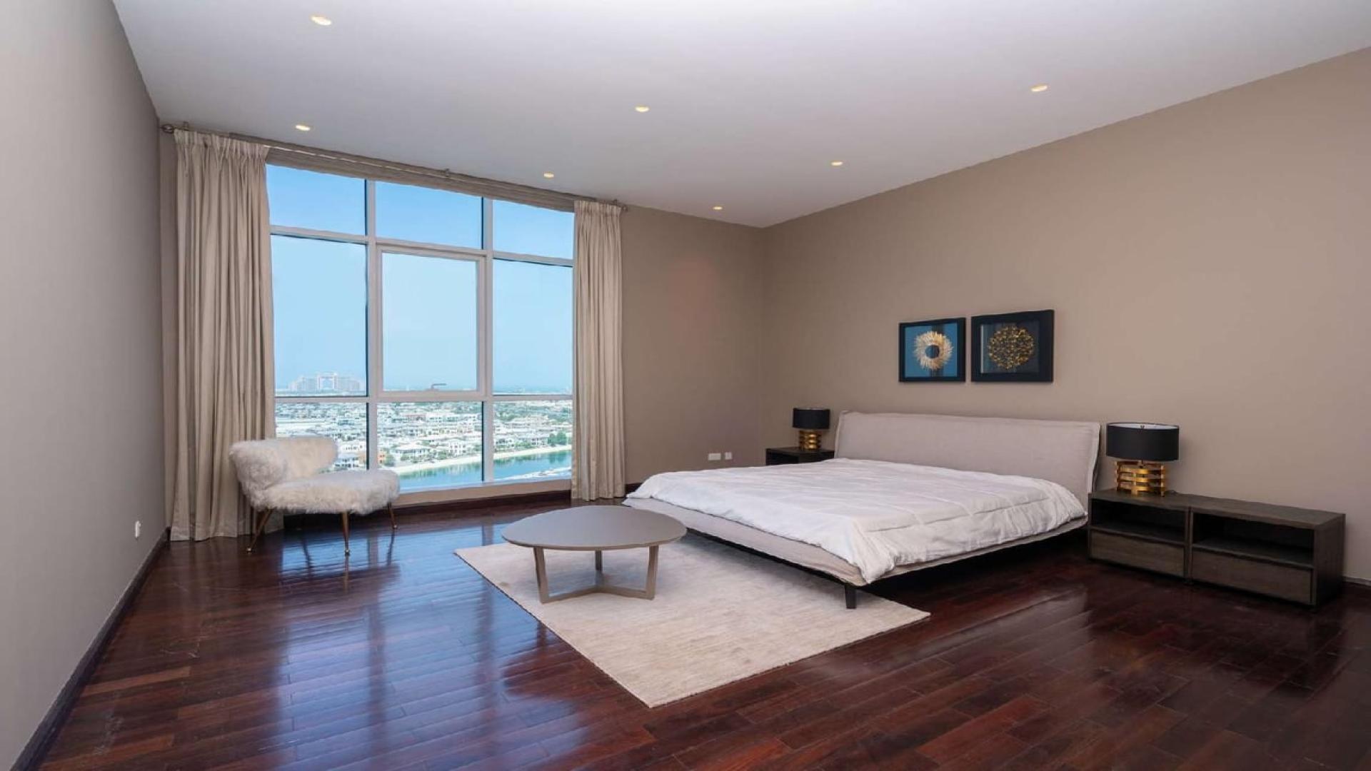 Modern living area in fully upgraded Palm Jumeirah penthouse with stylish furniture and decor
