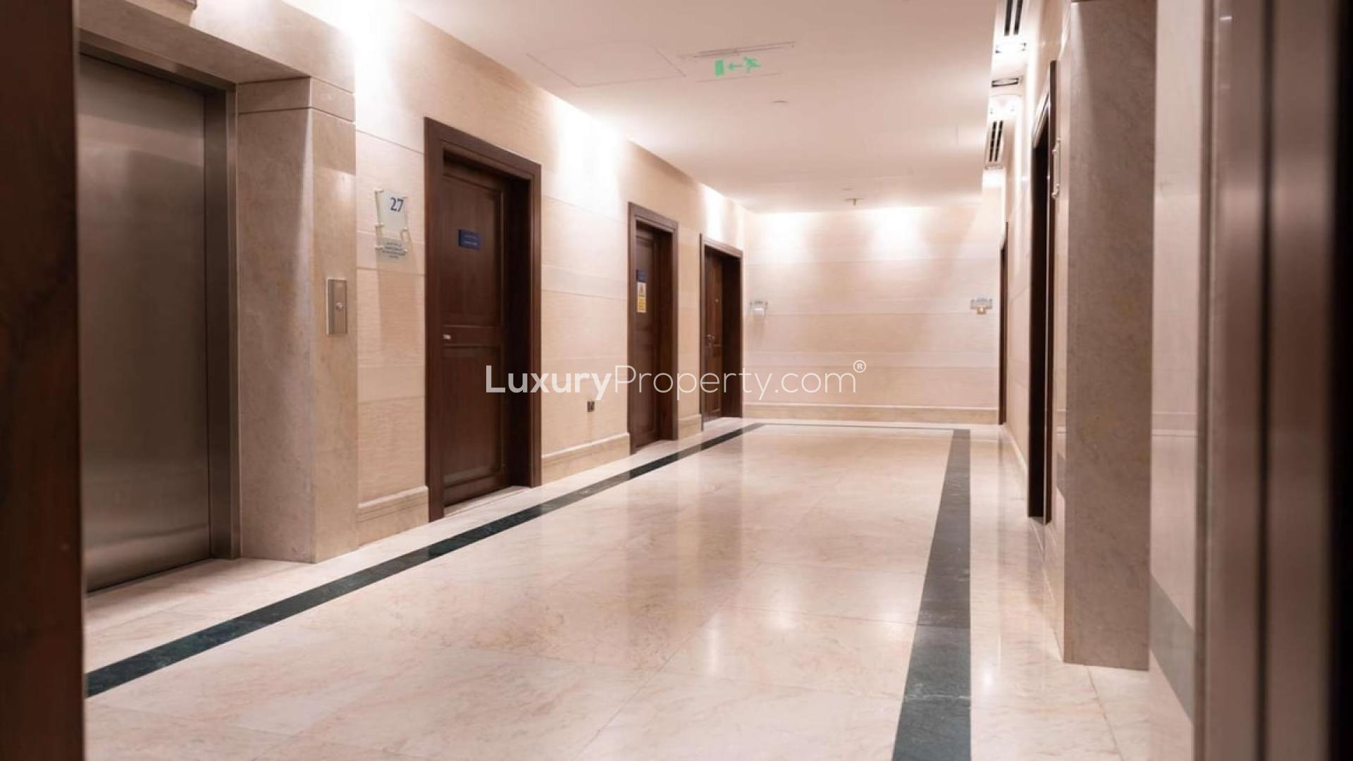 Elegant staircase and chandelier in Jumeirah Beach Residence penthouse for rent, Bahar community