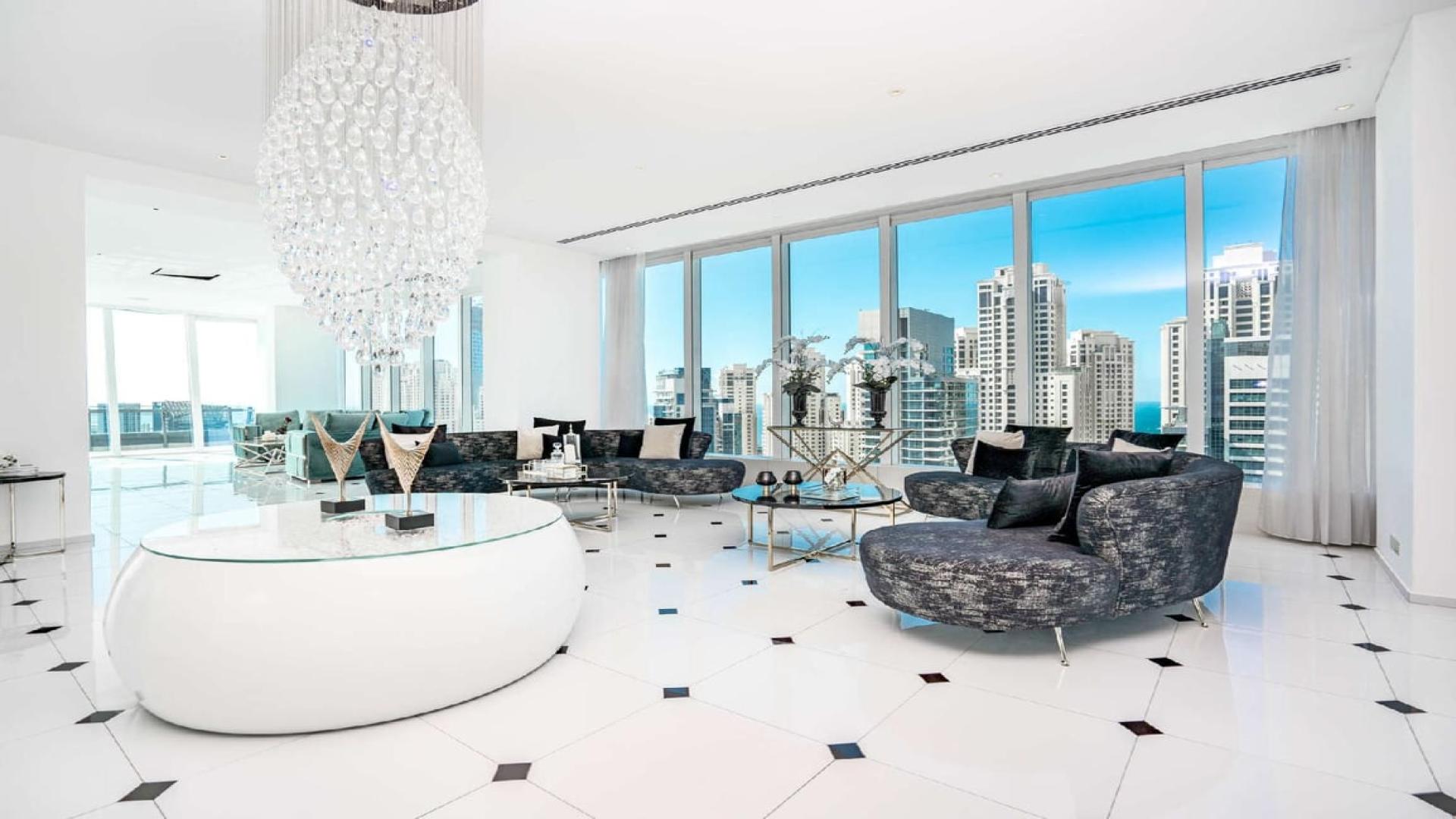 Luxurious living room with marina views in Silverene Towers penthouse, Dubai Marina