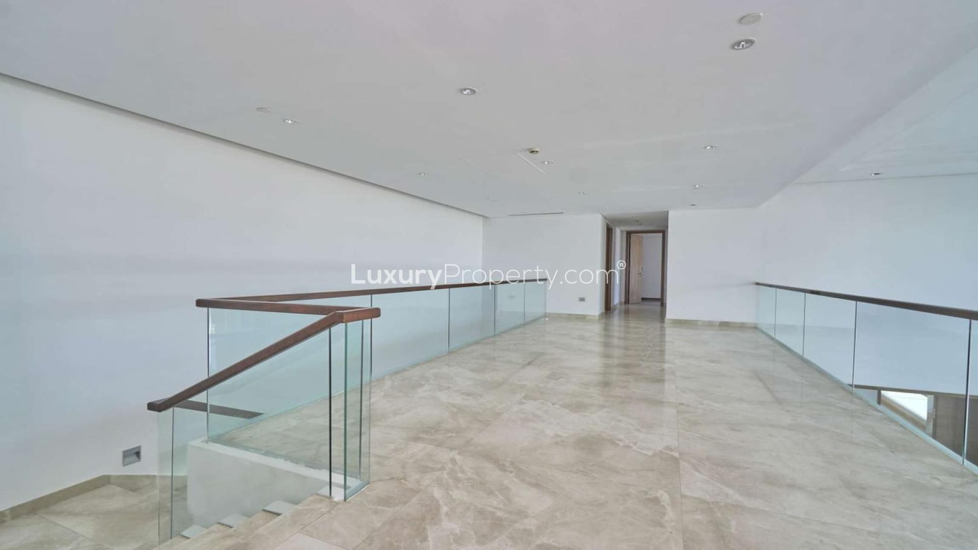 Modern kitchen with marble countertops in Palm Jumeirah penthouse, offering stunning ocean views