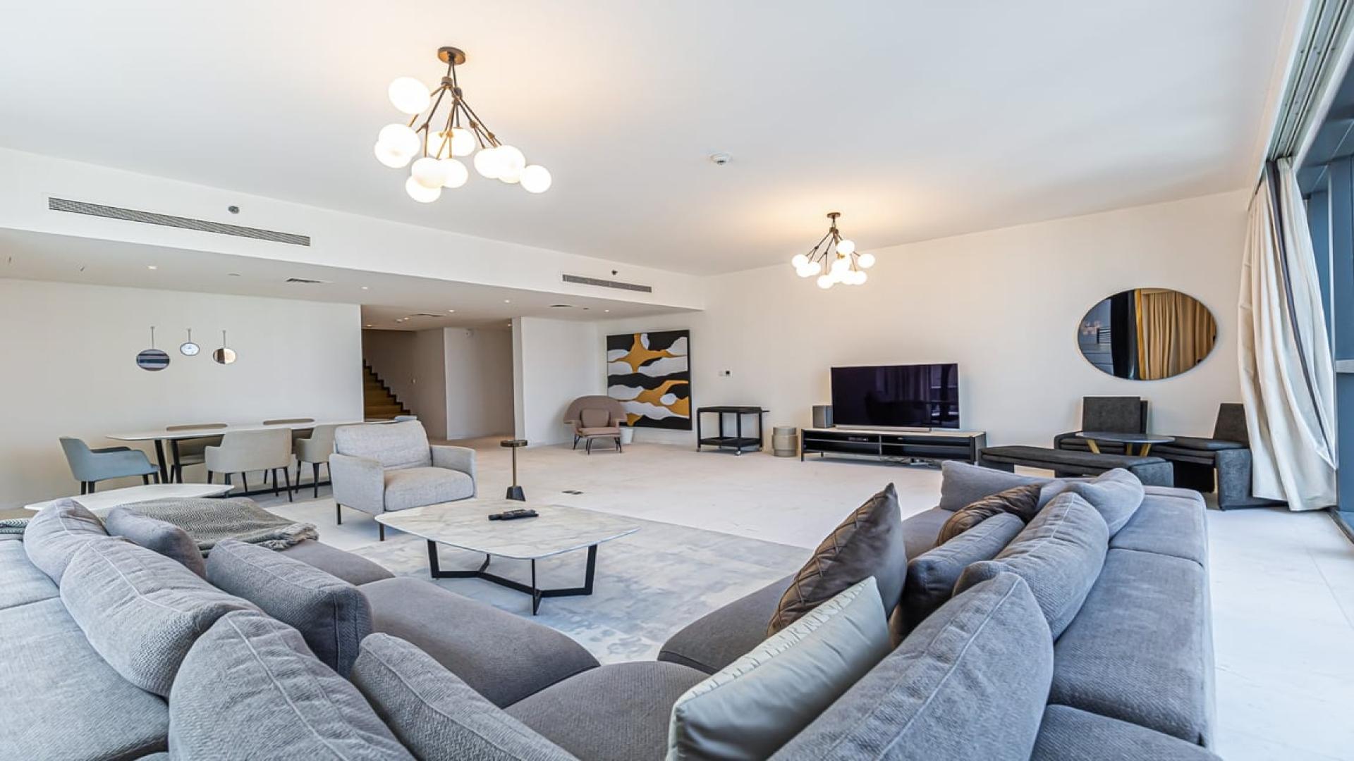 N/A,Spacious living room in luxury penthouse, Downtown Dubai, modern furnishings, ample natural light