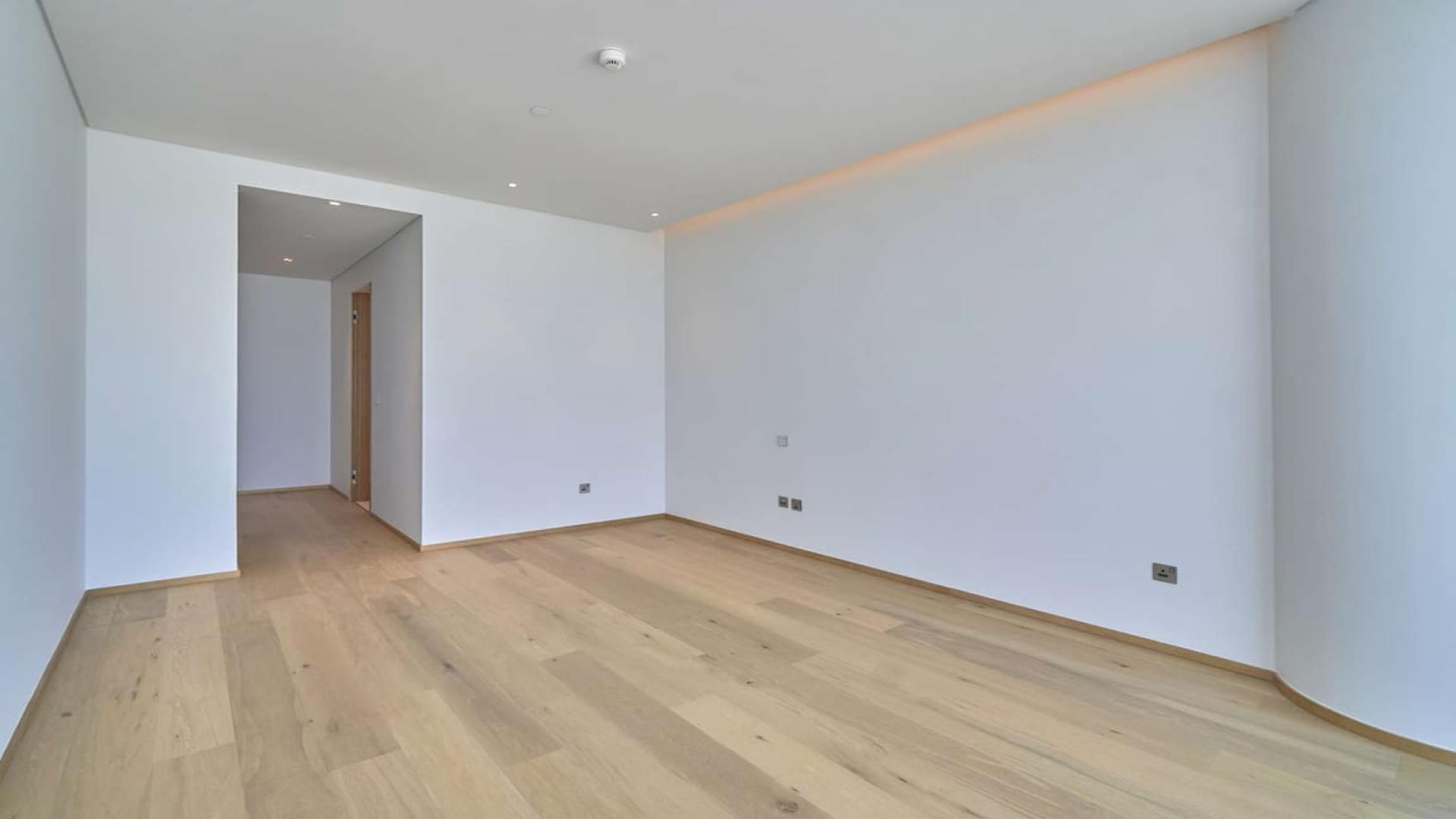 Spacious penthouse interior with floor-to-ceiling windows, stunning sea view at One Palm Jumeirah