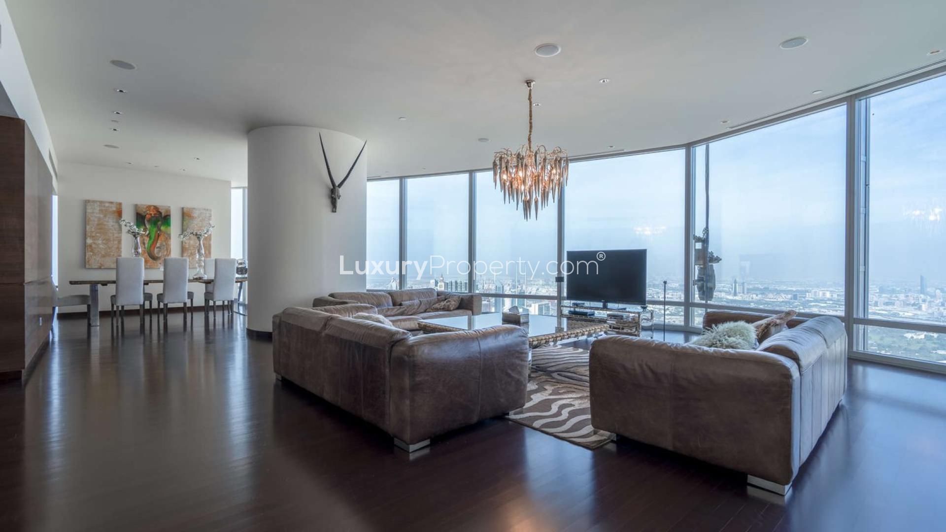 Luxurious living room in Burj Khalifa penthouse with stunning city views and elegant decor