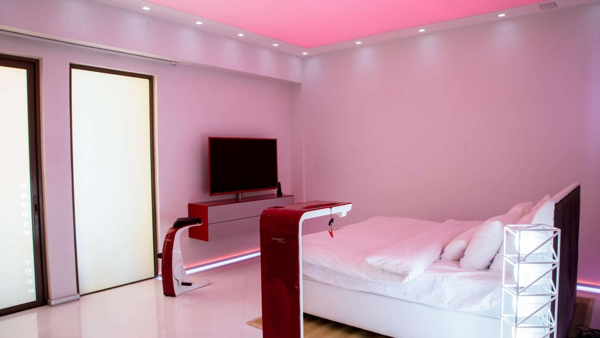 Modern bedroom with tech features in luxury Jumeirah Beach Residence penthouse, Rimal