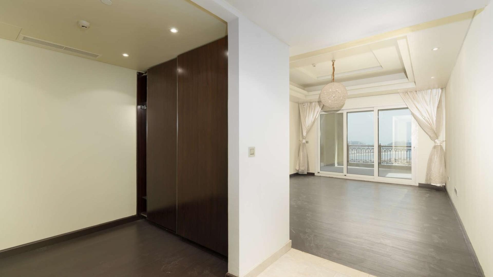 Furnished duplex penthouse interior with large windows in Marina Residences, Palm Jumeirah
