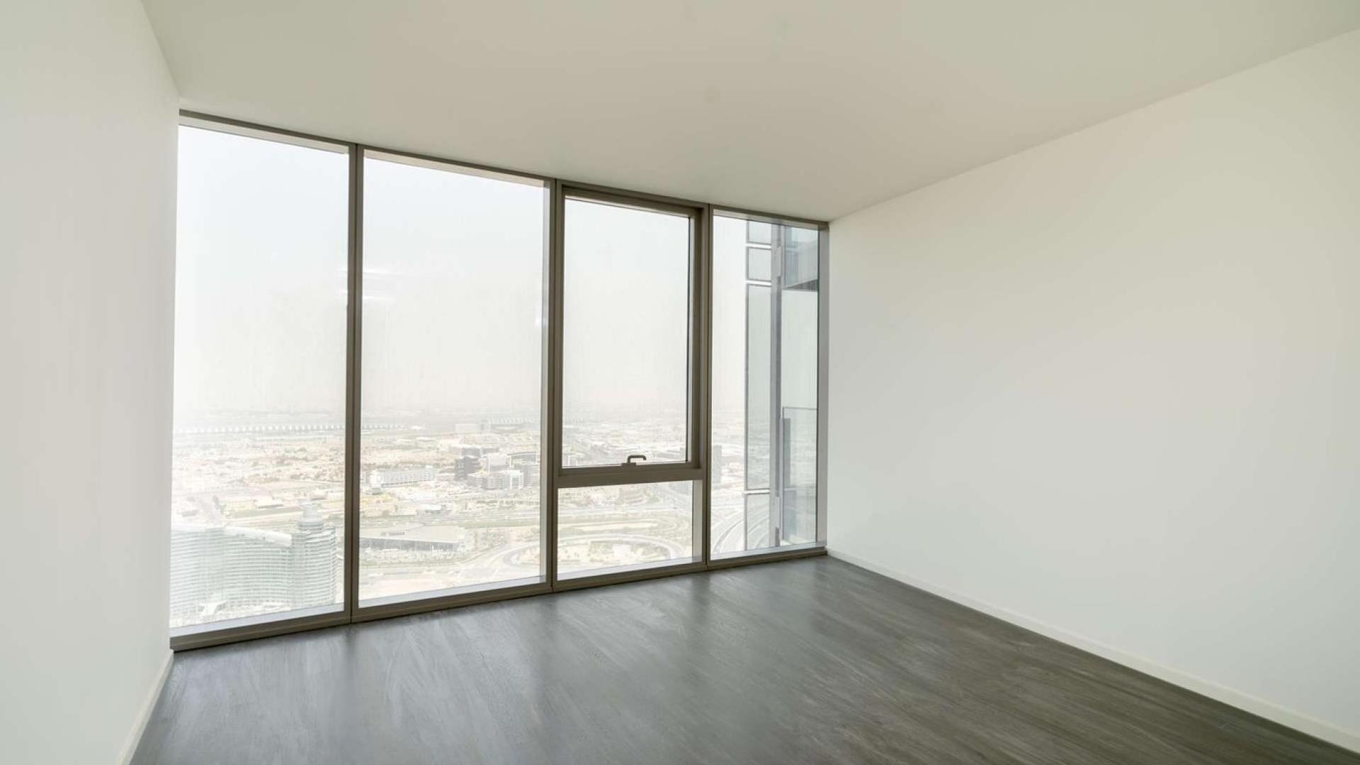Spacious living area with large windows in D1 Tower apartment, Culture Village, Dubai
