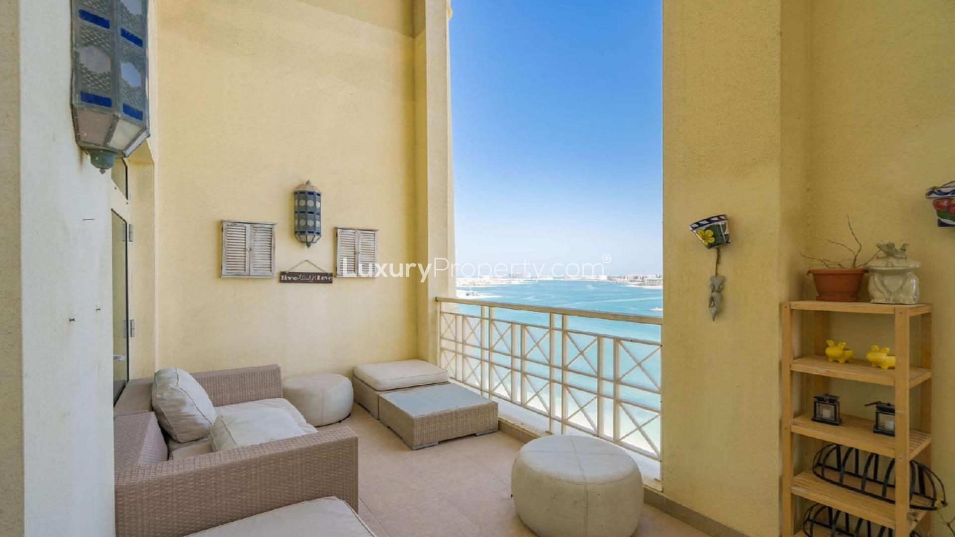 Luxurious living room in Palm Jumeirah penthouse with elegant staircase and modern decor