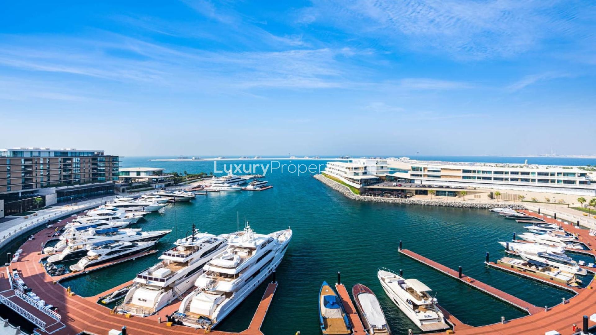Luxury yachts docked at Bulgari Resort Marina, Jumeirah Bay Island, Dubai. Stunning waterfront view