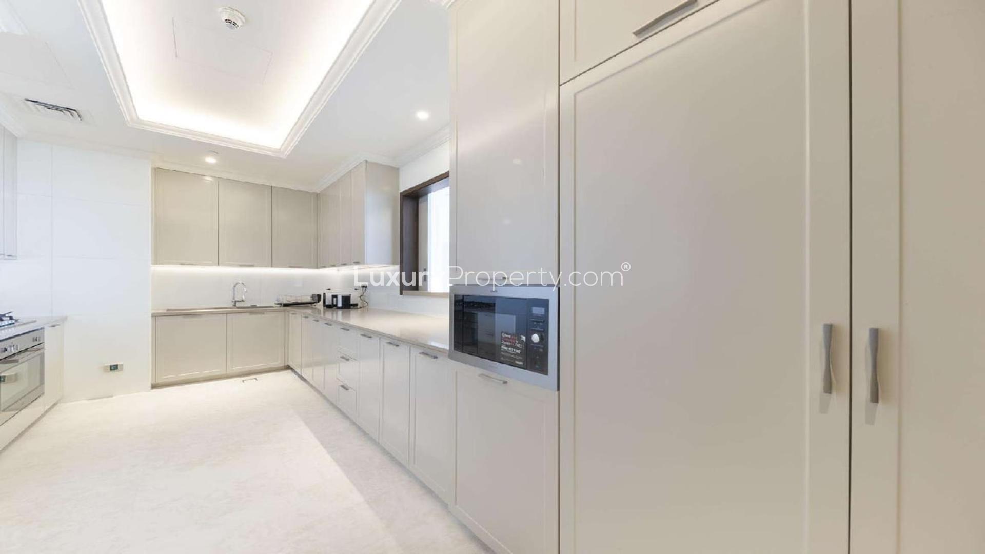 Luxurious living room in Downtown Dubai penthouse with cityscape views, modern decor, elegant lighting