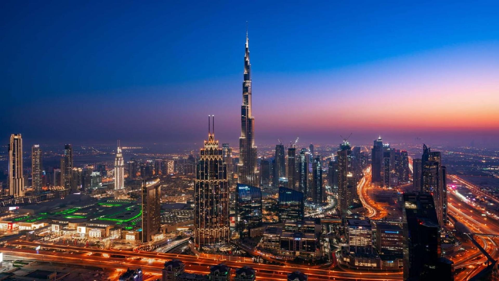 Luxurious Index Tower penthouse interior with elegant decor, spiral staircase, and large windows