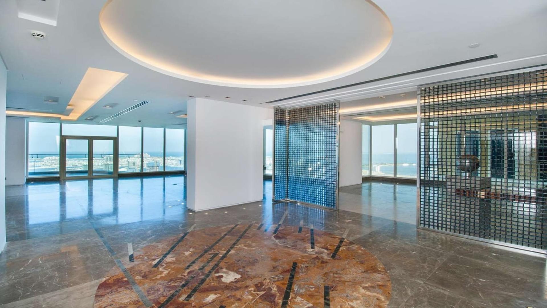 Spacious Dubai Marina penthouse with stunning seafront views, featuring luxurious open living area