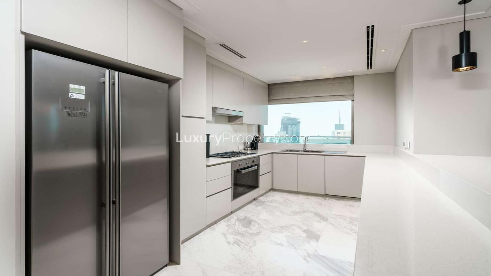 Luxurious living room in Vida Residences penthouse, Downtown Dubai, with city skyline views