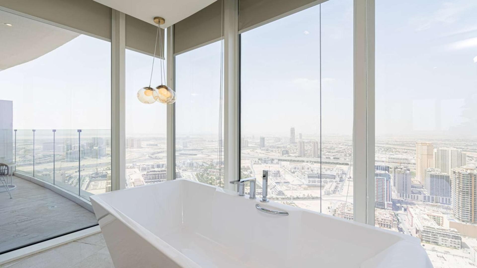 Rooftop pool with city views in Jumeirah Village Circle penthouse, Dubai