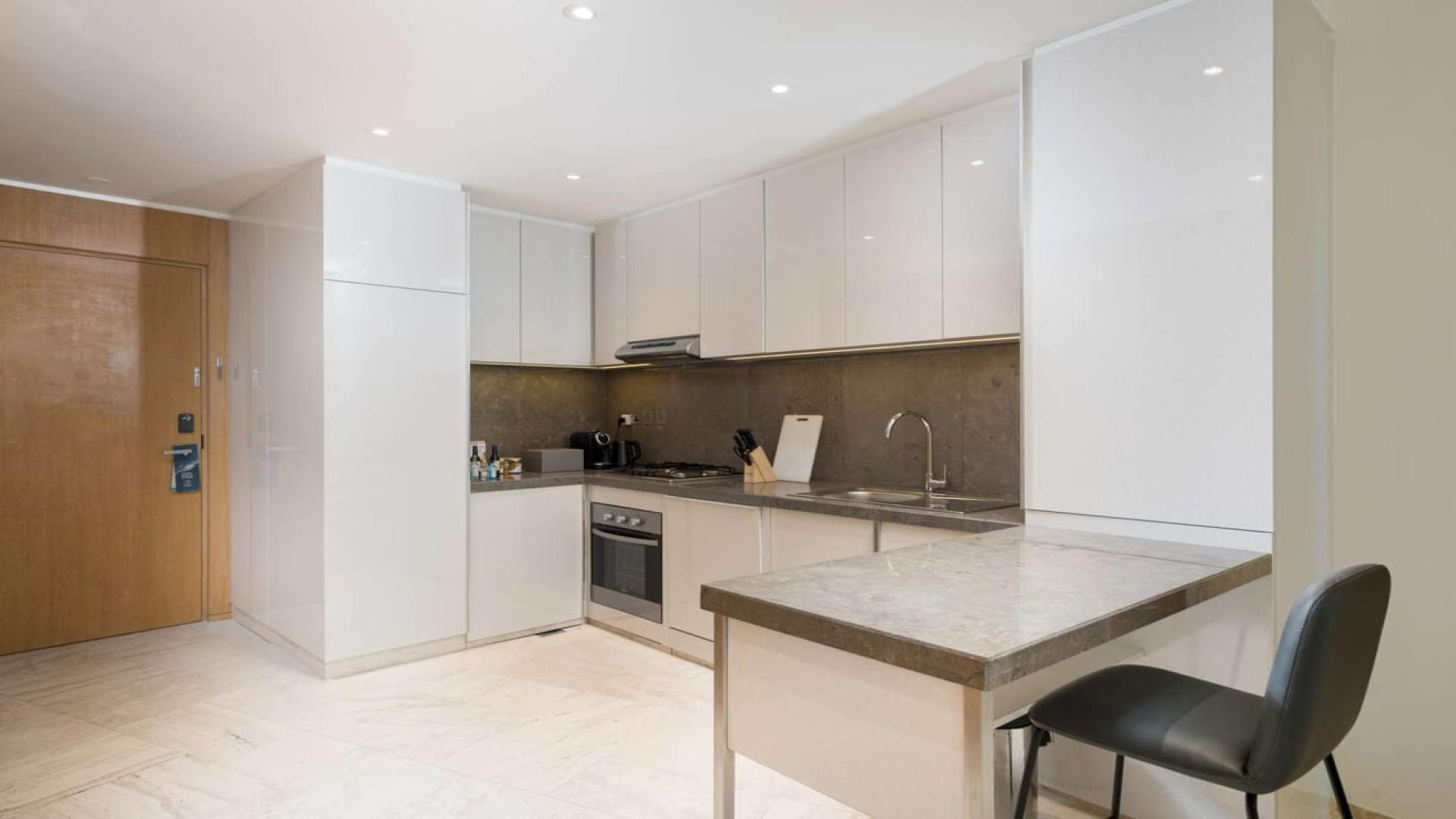 Modern living area in 4-bedroom penthouse, The Five, Jumeirah Village Circle, bright and spacious