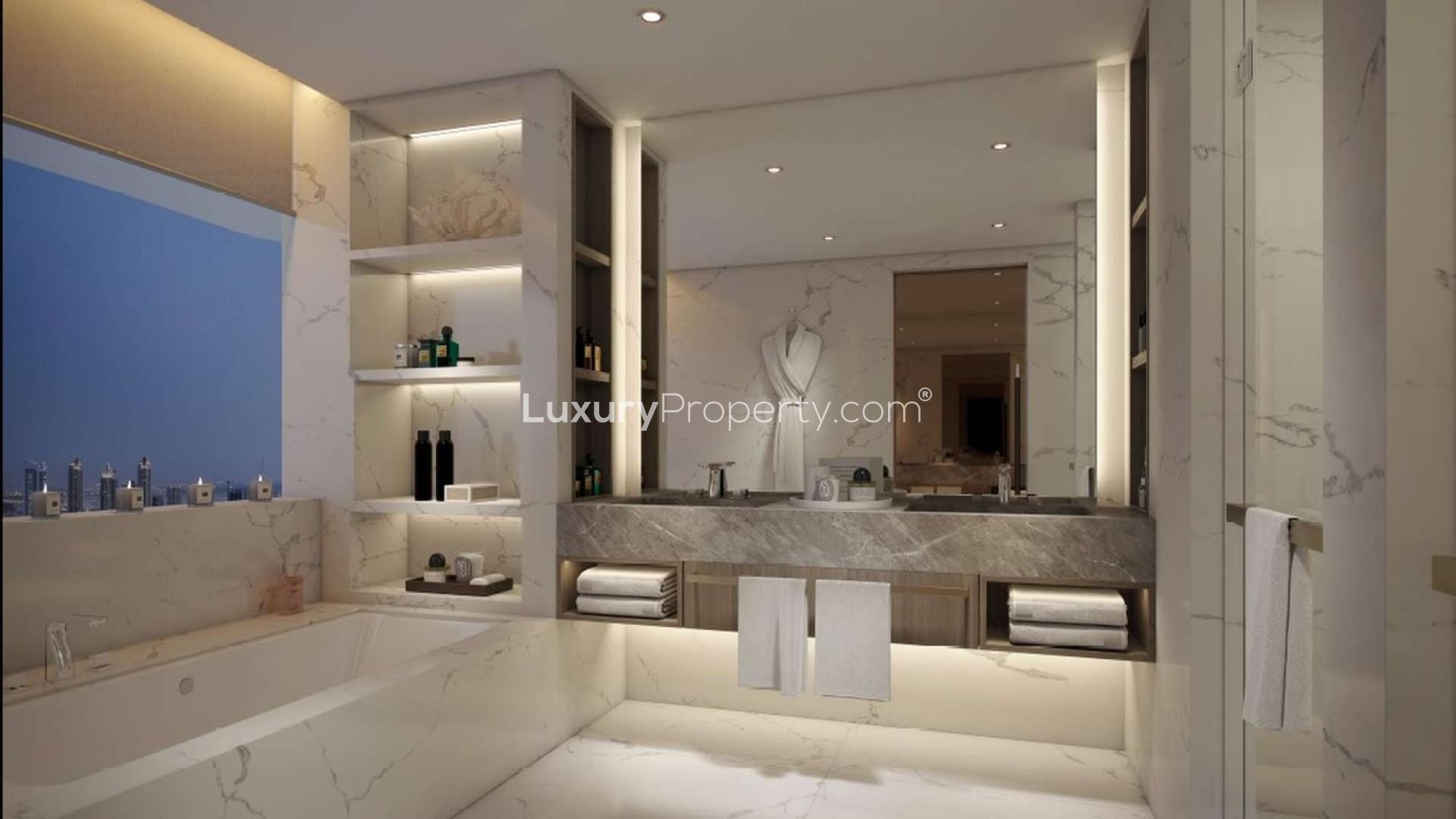 Luxurious bathroom in IL Primo Downtown penthouse, featuring marble finishes and elegant lighting