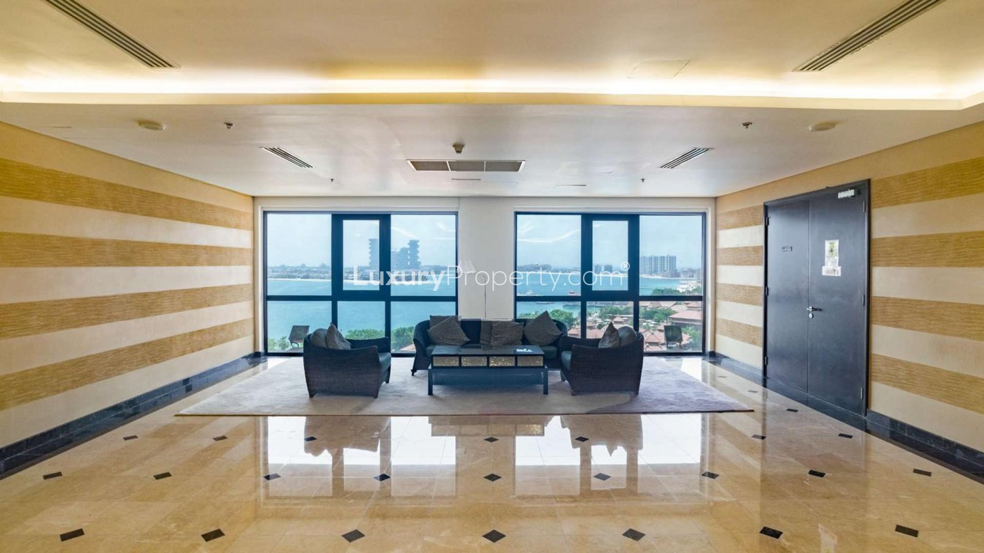 Aerial view of luxury penthouse community at Anantara Residences, Palm Jumeirah, with pool and sea