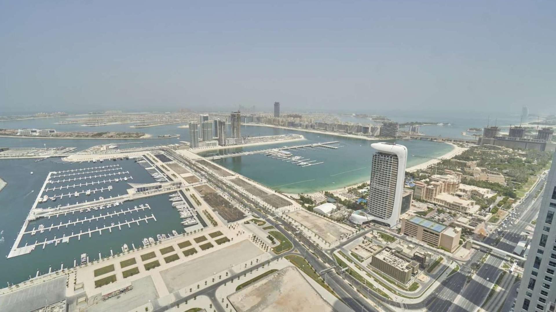Dubai Marina skyline view from Damac Heights penthouse, featuring luxury yachts and waterfront