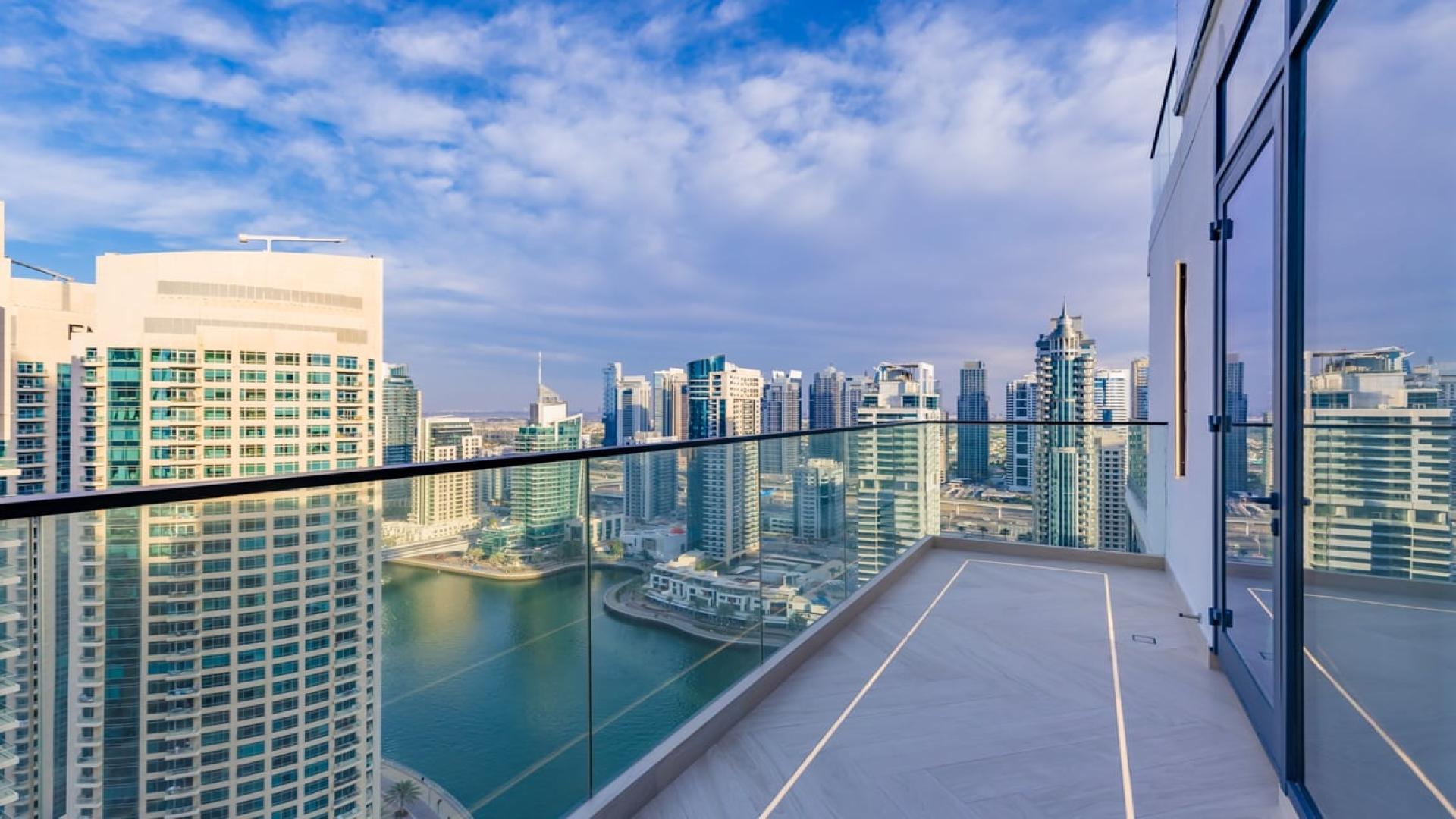 Luxurious living room in Dubai Marina penthouse, LIV Residence, featuring modern design and city views