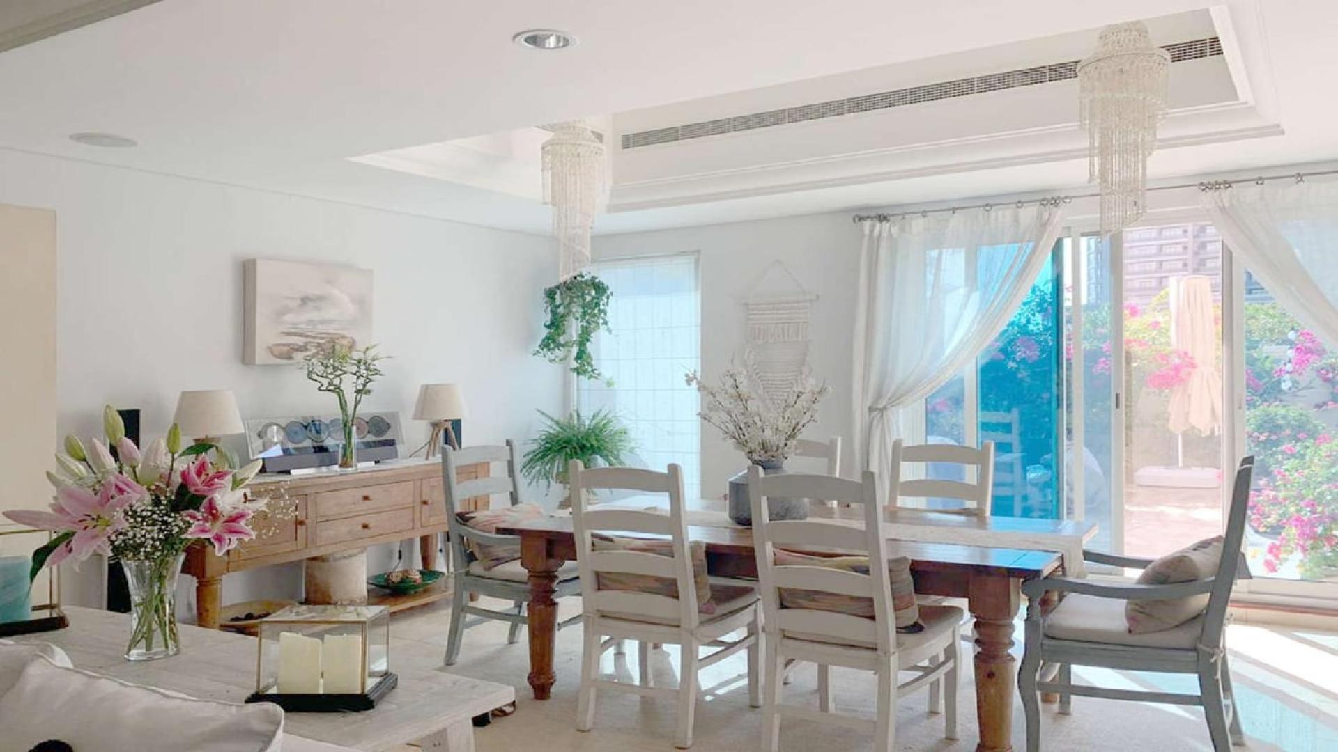 Spacious upgraded townhouse interior with open-plan kitchen in Victory Heights, Dubai Sports City