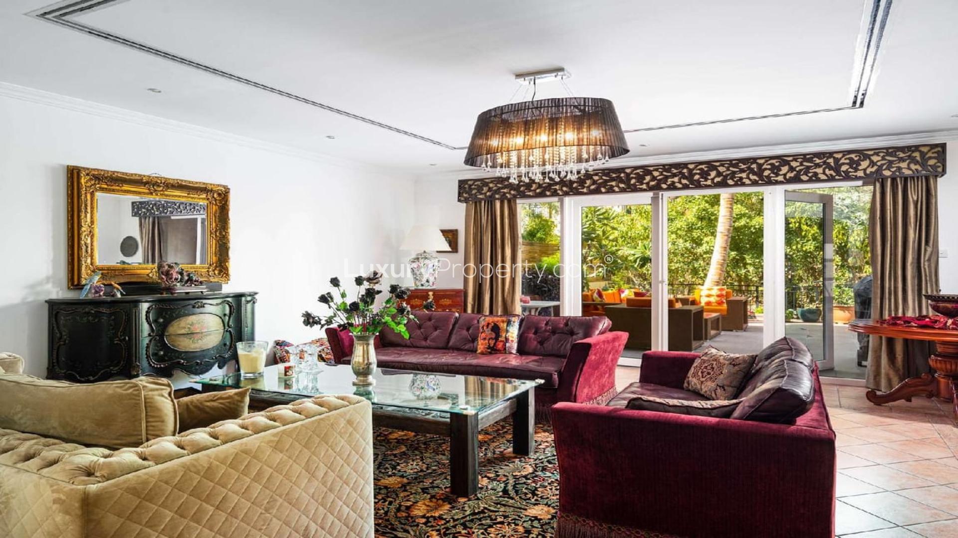 Luxurious living room in 4-bedroom townhouse, Green Community East, with elegant decor and garden view